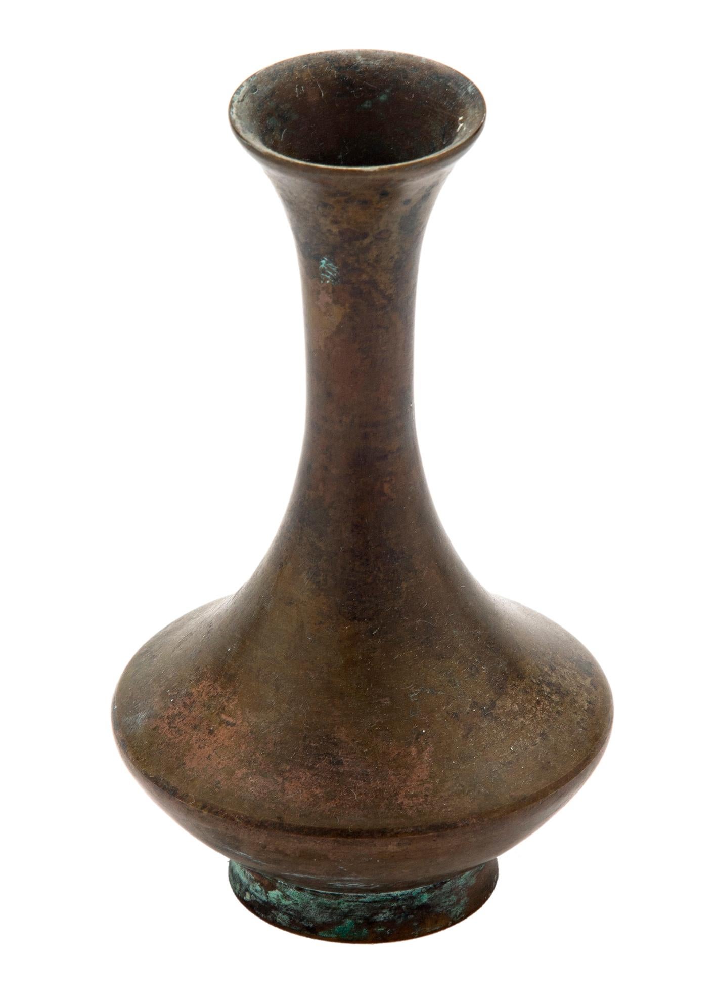 Mottled bronze bud vase having a rare & unique form with flared mouth & curvaceous profile.