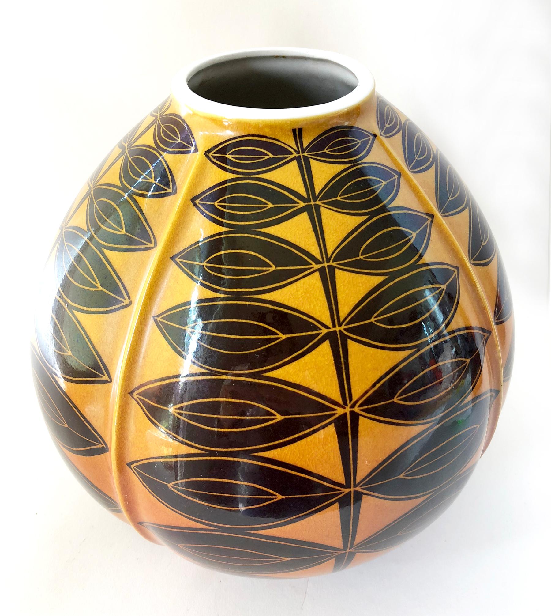 Large-scale Satsuma porcelain vase, hand glazed in gold to copper gradation with black modernist leaf design. Vase measures 9.5