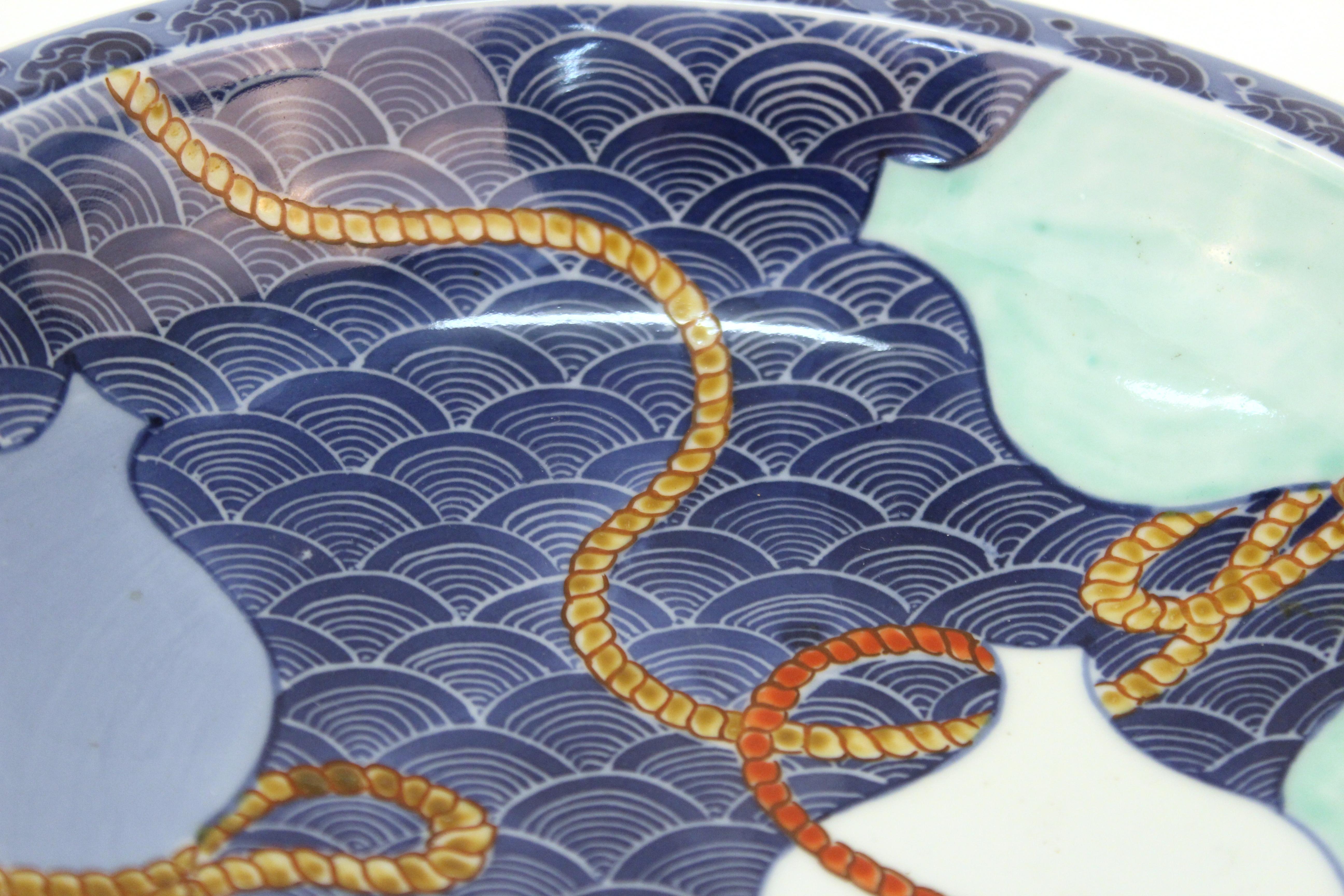 Mid-19th Century Japanese Nabashima Porcelain Blue Plate with Three Sake Bottle Motif For Sale