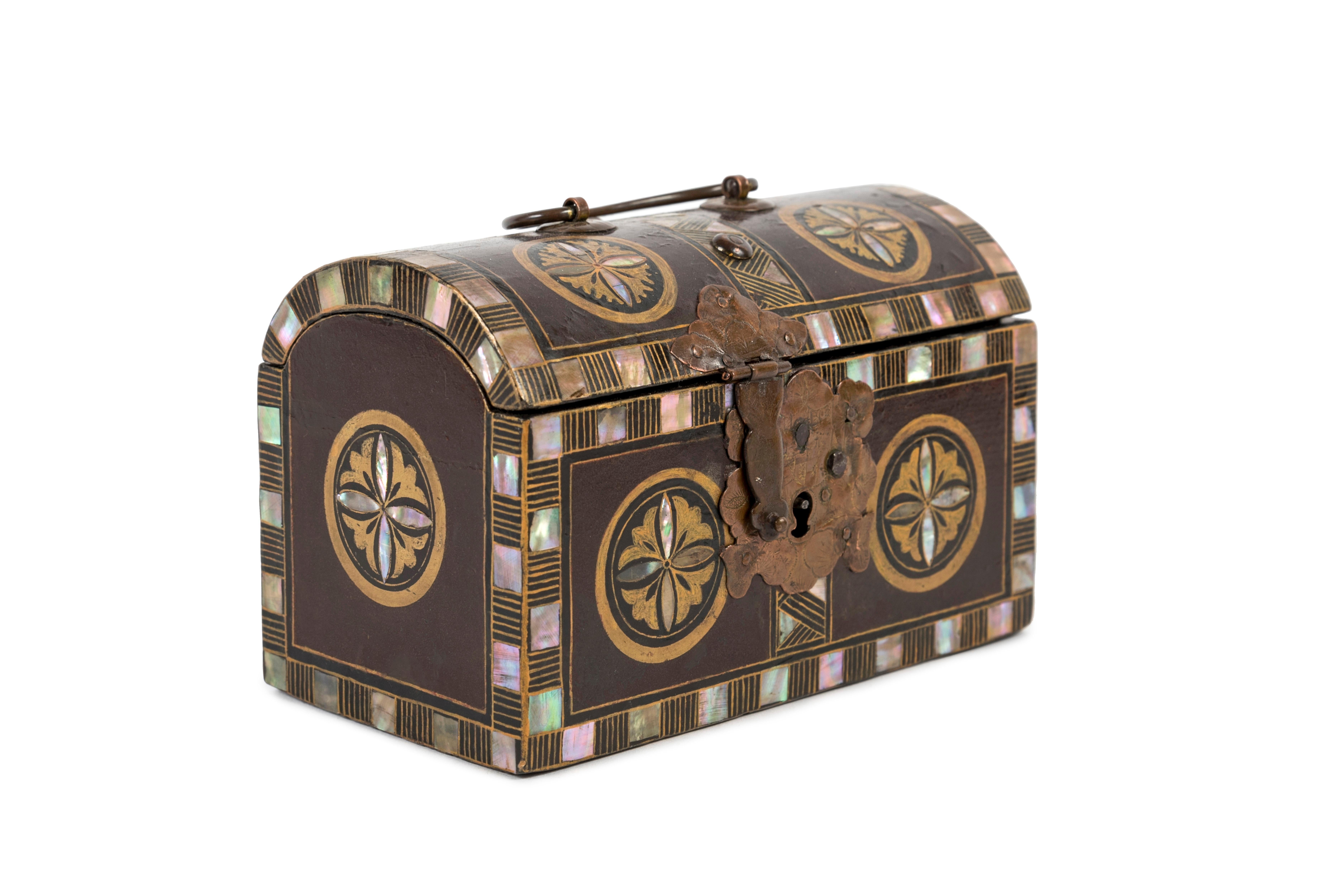 Small namban style chest with a semi-cylindrical lid made of black lacquered wood (urushi) with gold lacquer (maki-e) and inlaid with mother-of-pearl (raden). 
Mon style decoration (family emblem) of ginkos and chrysanthemums framed by friezes