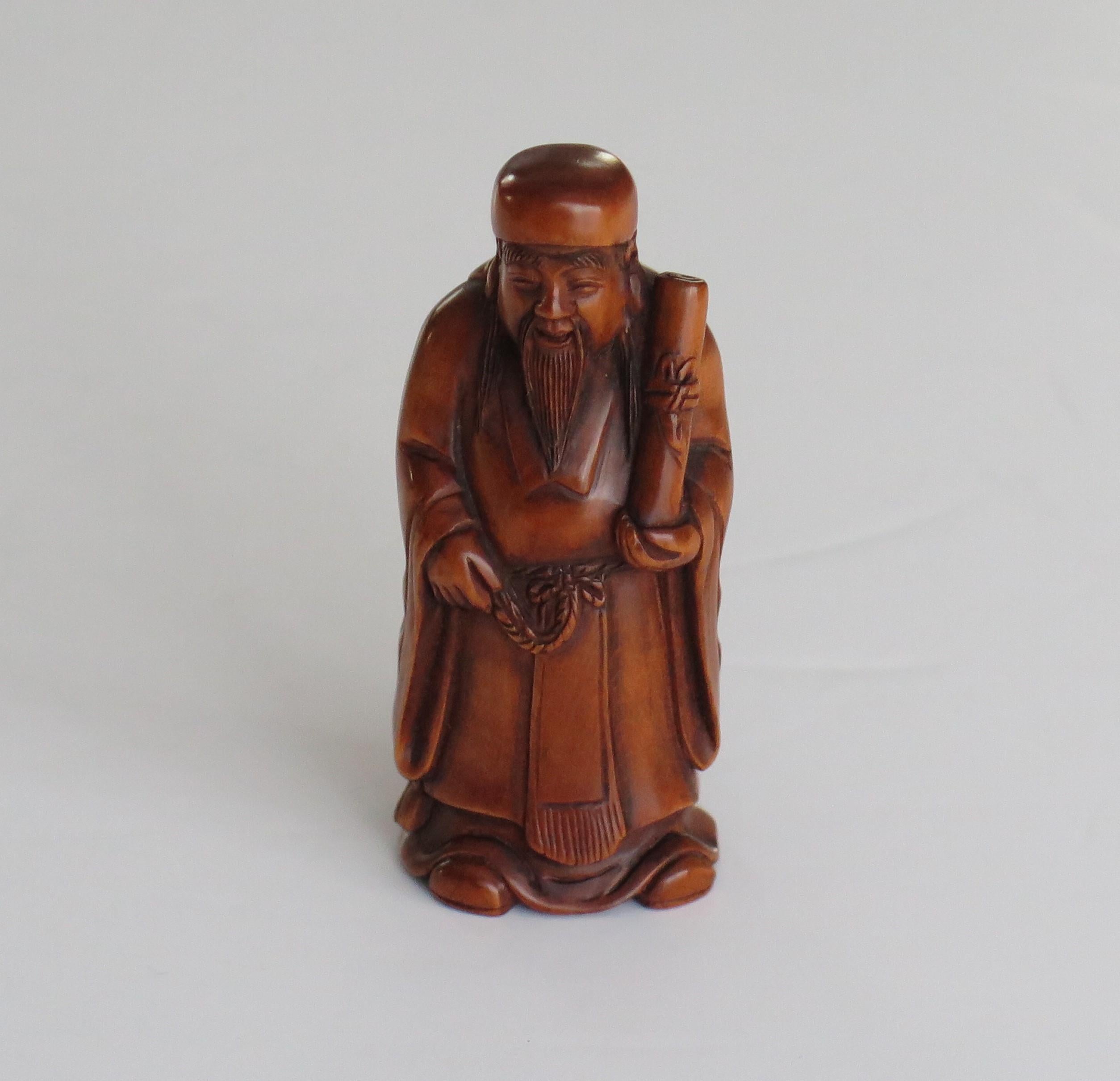 Porcelain Japanese Netsuke of Chinese sage with scroll made of boxwood Signed, circa 1920