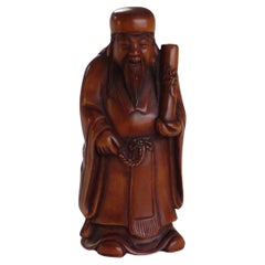 Japanese Netsuke of Chinese sage with scroll made of boxwood Signed, circa 1920