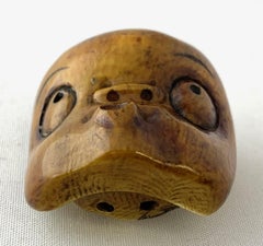 Japanese Netsuke of Hyottoko, Depicted through a Mask in Noh Play as an Idiot