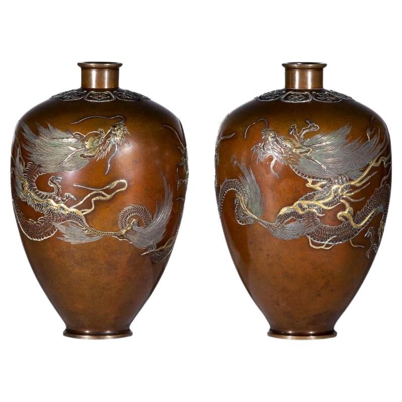 Japanese Nogawa company pair of patinated bronze