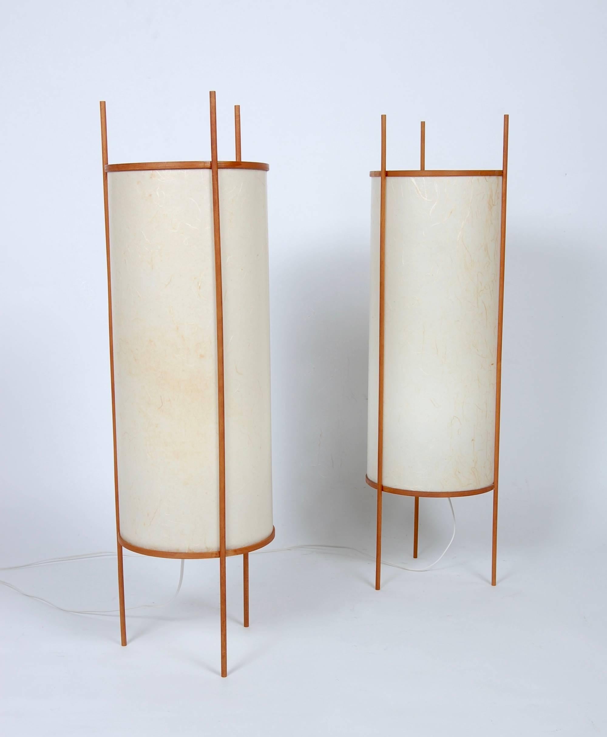Tall Japanese table or floor lamps wood frames with infused fibers in the fiberglass shades, newly rewired.