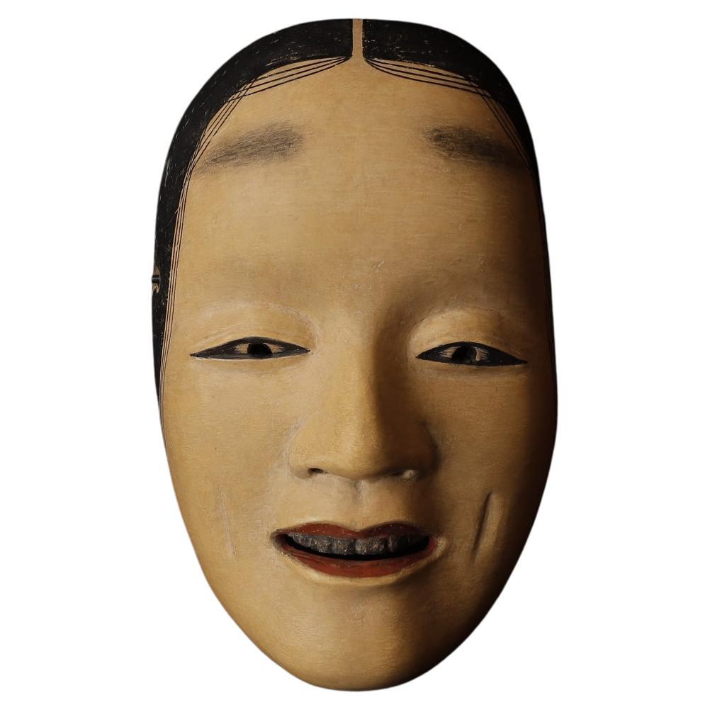 Ko-omote

The Ko-omote mask is most often used in Noh performances to depict young women of noble birth or spirits of young maidens. Characters portrayed with this mask are usually gentle, refined, and often in roles that involve romantic love,