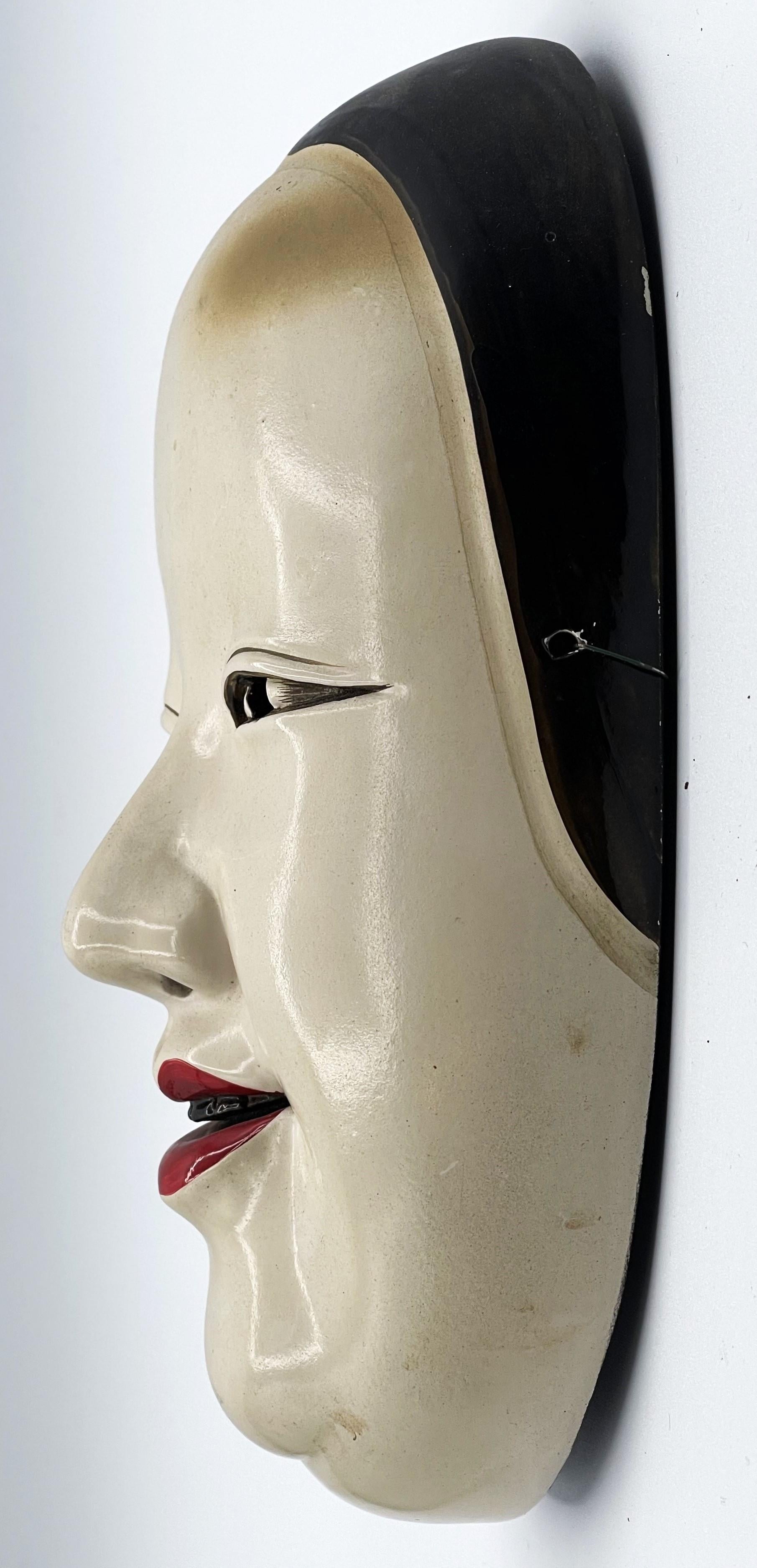 Máscara Ko-Omote del Teatro Noh Japonés, principios del siglo XX

DIMENSIONES:
Altura: 8,5 pulgadas
Anchura: 4,5 pulgadas
Profundidad: 3 pulgadas

ACERCA DE
Máscara Ko-Omote finamente tallada y pintada, utilizada en el teatro tradicional japonés