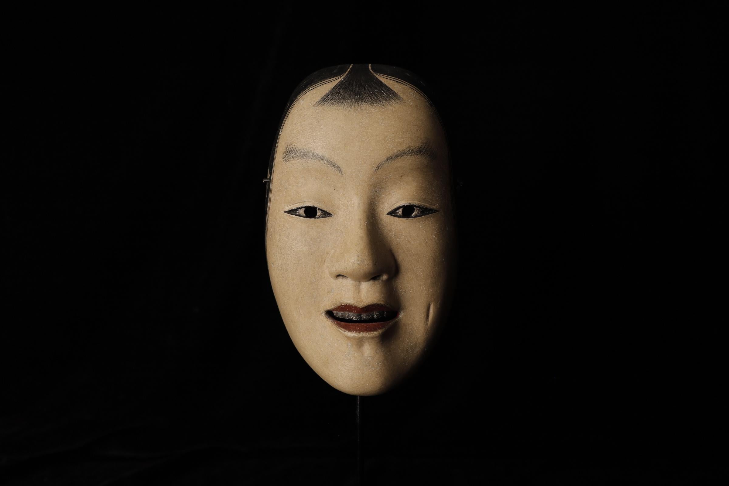 Kashikobito (賢人)
This mask is used in Noh theater to represent a wise person or an intelligent young boy. This type of mask is associated with characters who are young, noble, and possessing great wisdom despite their youth.

The Kashikobito mask