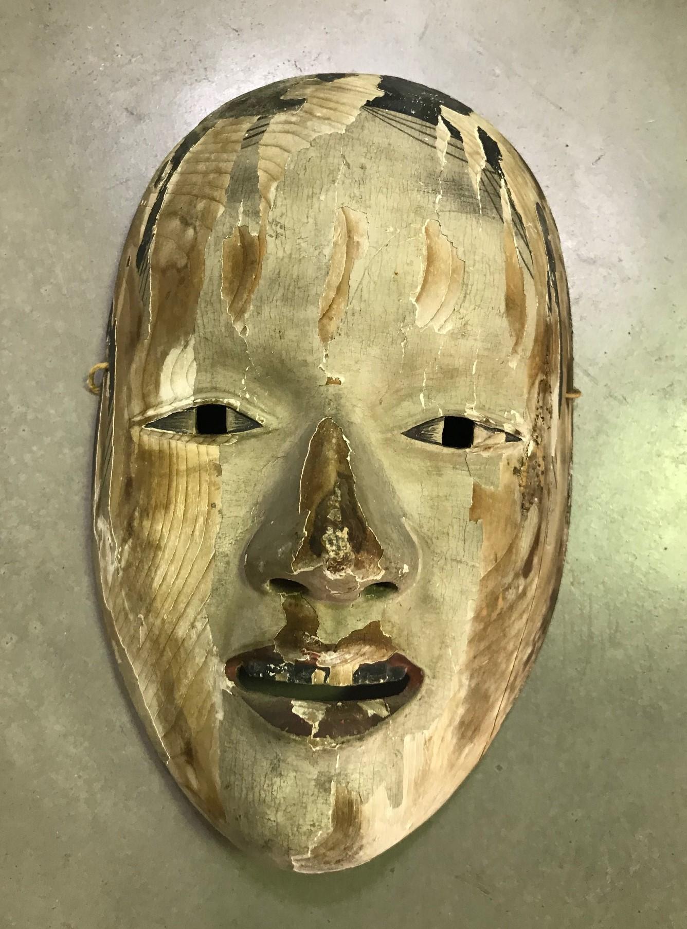 A truly beautiful, wonderfully aged, alluring mask made for Japanese Noh theater. The natural faded beauty and unique character drew us to this mask immediately.

This mask is handcrafted and carved from natural wood and lacquer.

Ko-omote