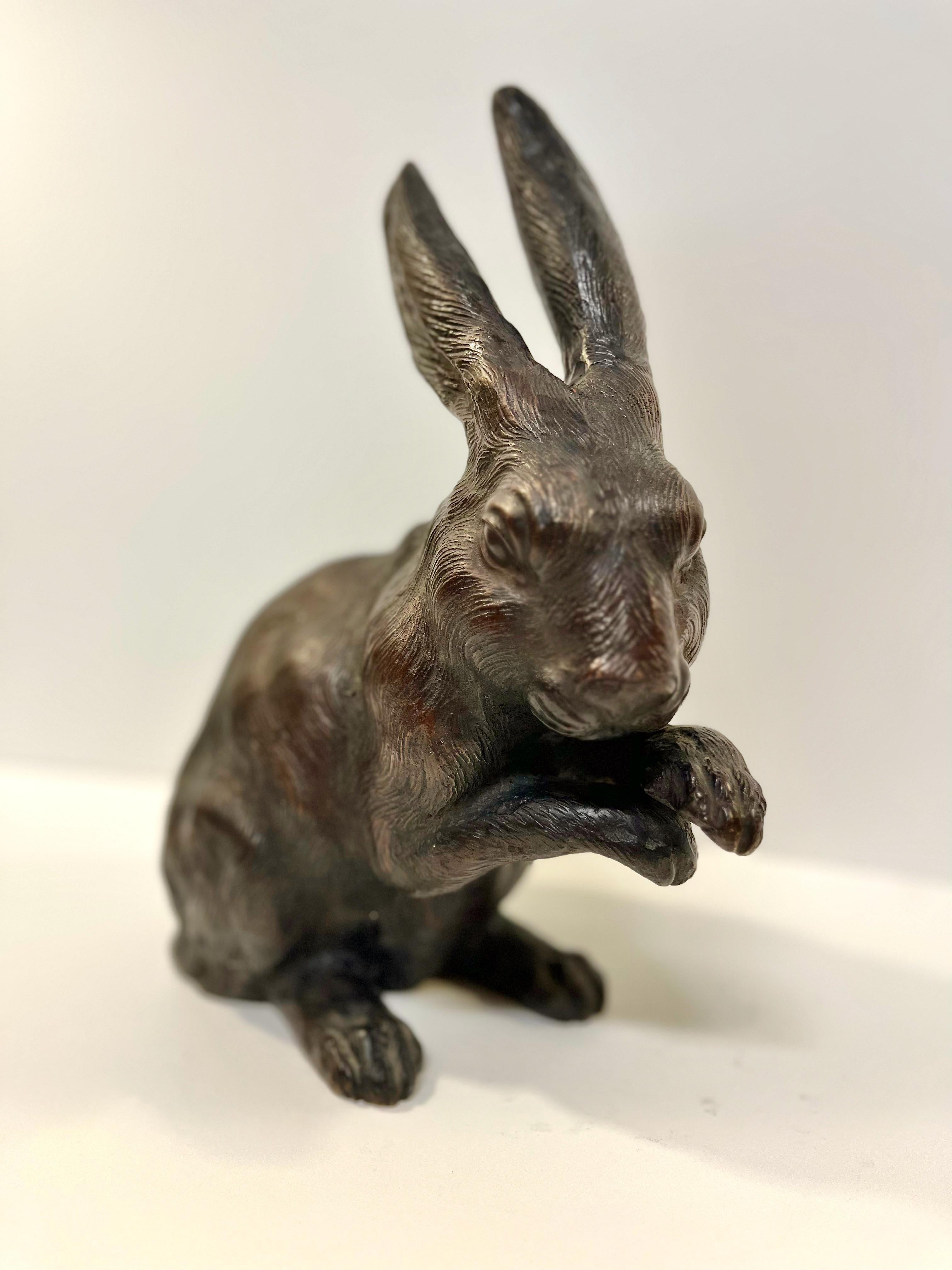 This is an impressive Okimo of a rabbit in a resting position. The bronze is very well cast in the form of a realistic rabbit. The bronze is signed on the bottom of one foot, as shown in photo. It is thought that having a rabbit in the house would