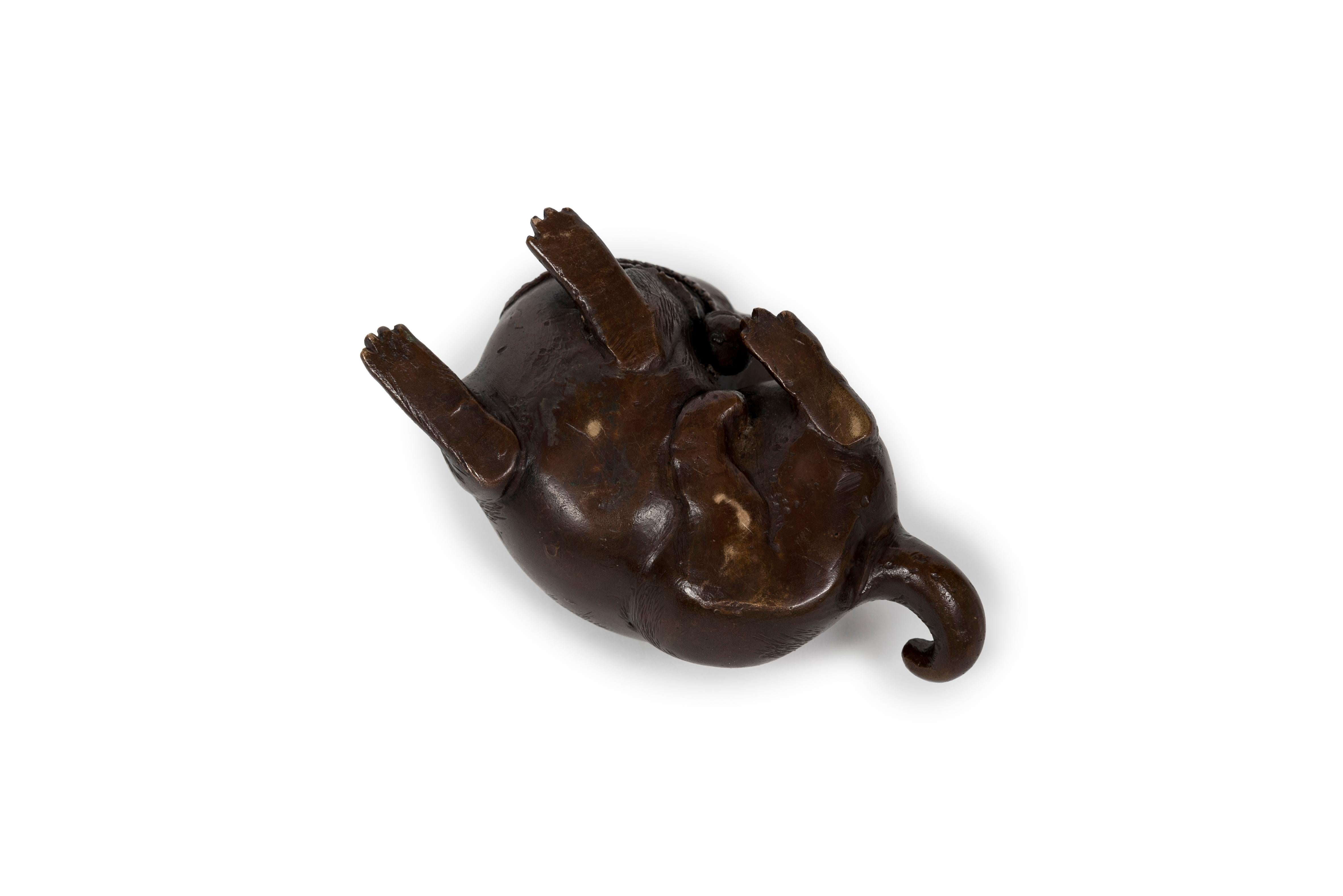 19th Century Japanese okimono sculpture of a lying puppy with its head facing its rear For Sale