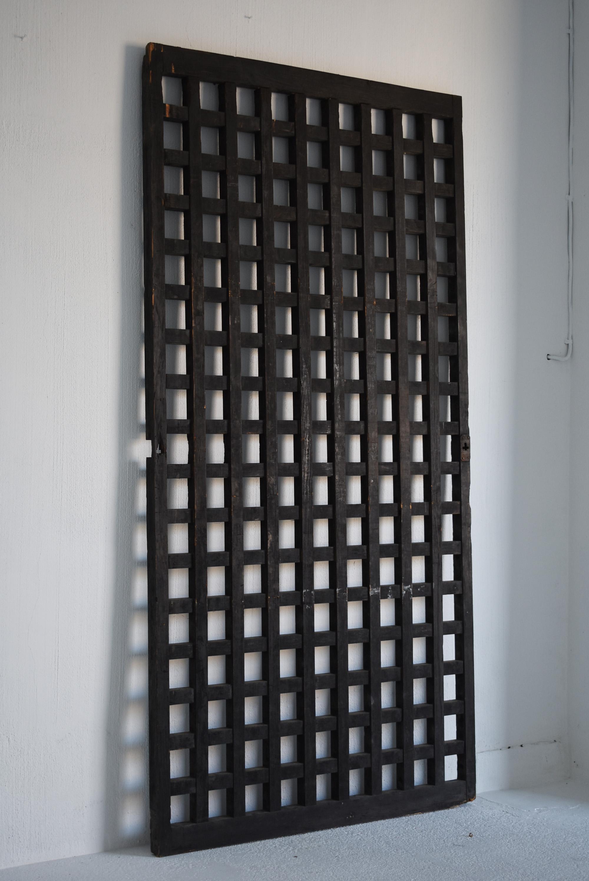 It is an old Japanese lattice door.
It is an item from the Edo period to the Meiji period.
The material seems to be cedar.

It was used as a fitting for the warehouse.

It's a very valuable door.

You can actually use it, but it is also