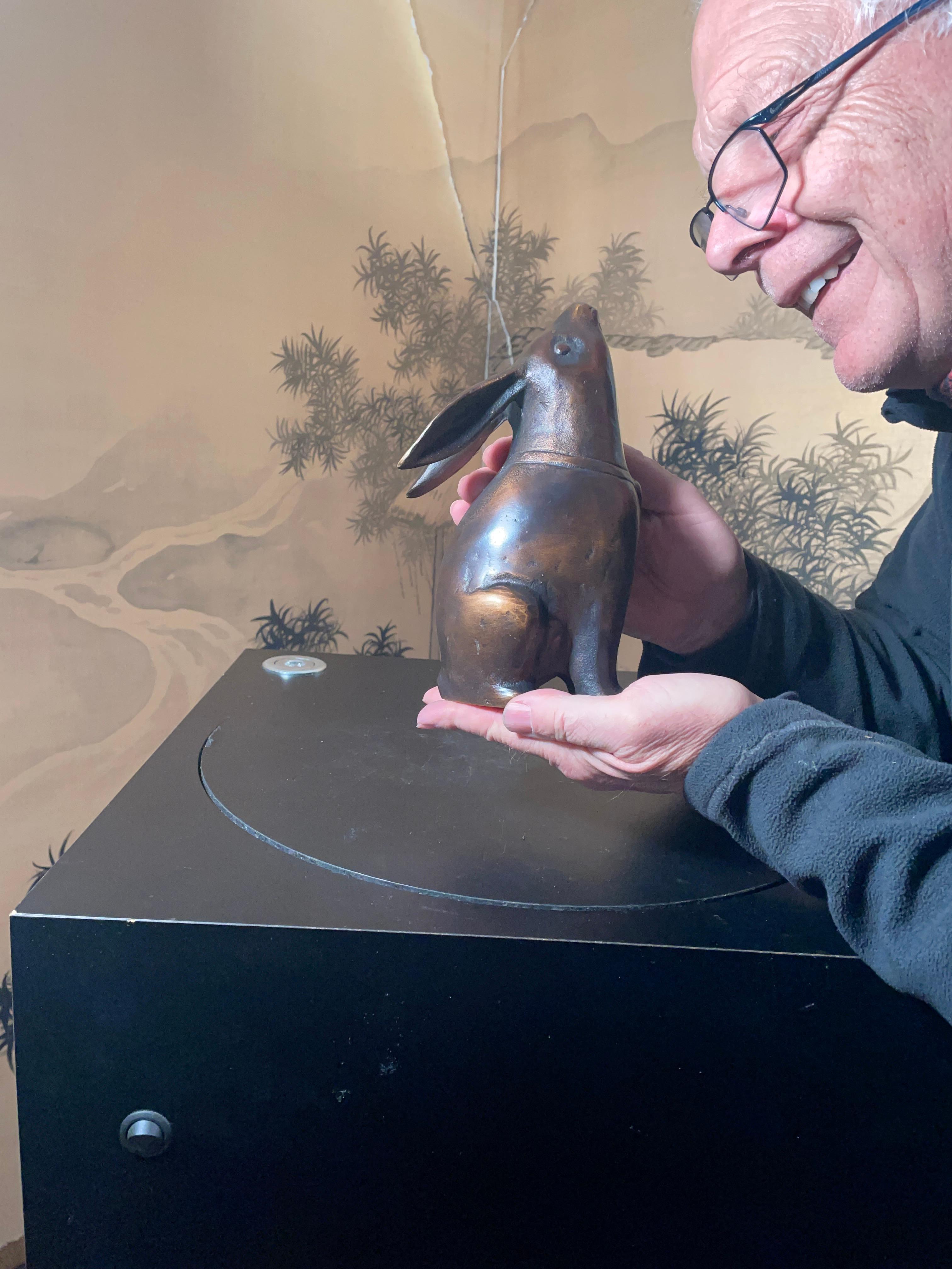 For your special garden spot - a tall smooth bronze finish Moon Gazing Rabbit with its signature lengthy floppy ears.

This is a hard to find and finely cast effigy of a tall 