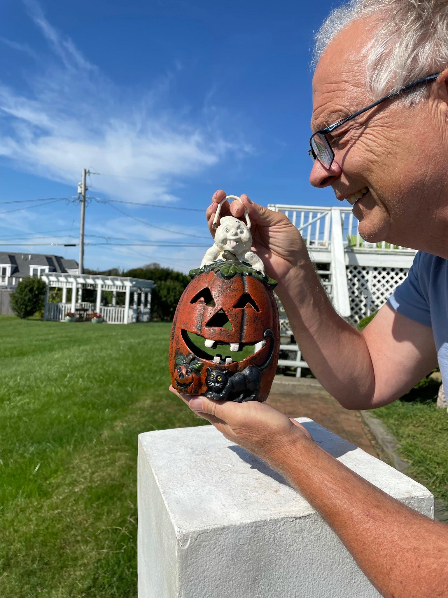 The first we have seen- immediate shipment for celebration and display !

Japan, this rare handsome quality old vintage iron Halloween Jack-O-Lantern with its charming white ghost popping out from its roof still retains its white, green, and
