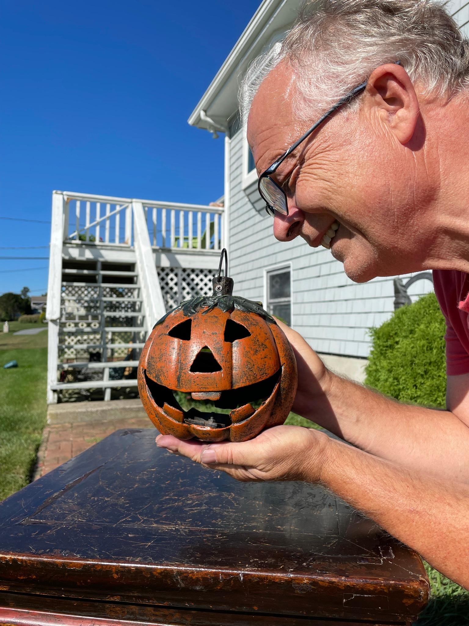 From our recent acquisitions- an old vintage example

Japan, this handsome quality iron halloween Jack-O-Lantern with its two charming faces still retains its original black, green, and orange paint plus includes its original sturdy suspension top