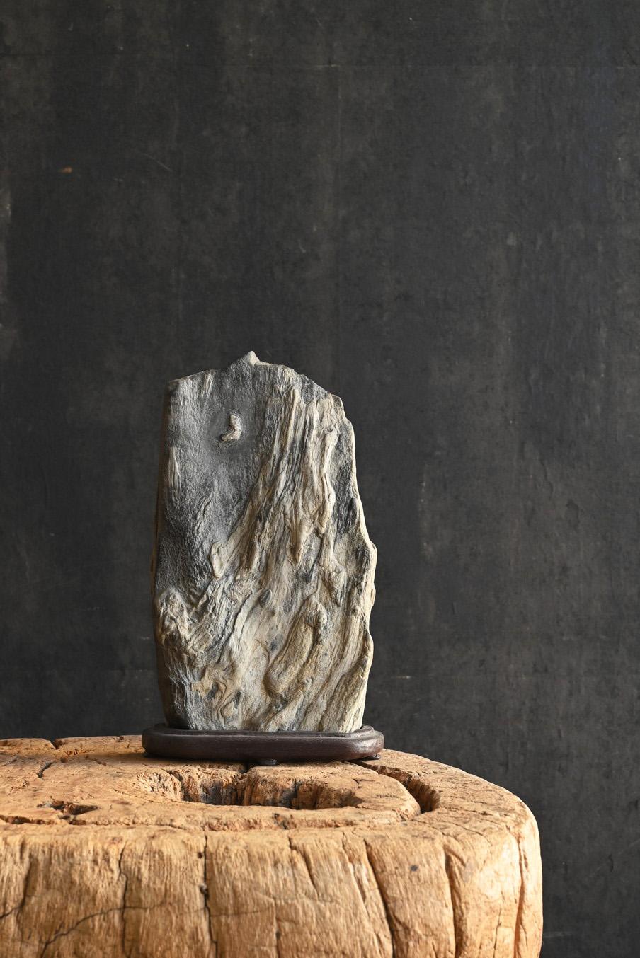 Suiseki is a traditional Japanese viewing stone, admired for its beautiful natural shape. The name 