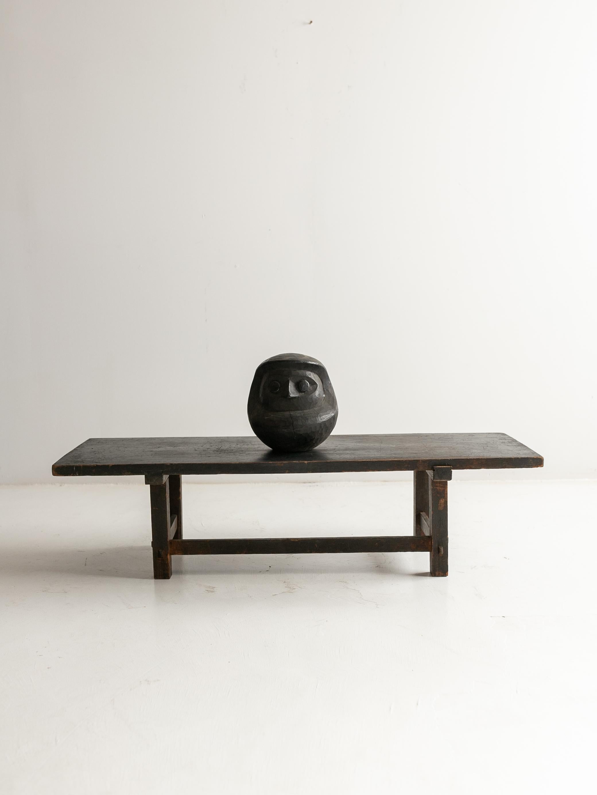 This Japanese antique wooden black low table was made between the late Edo and Meiji periods.
All materials are cedar wood. Cedar has been a common wood used for tools and furniture in Japan since ancient times.
The rustic grain of the top panel is