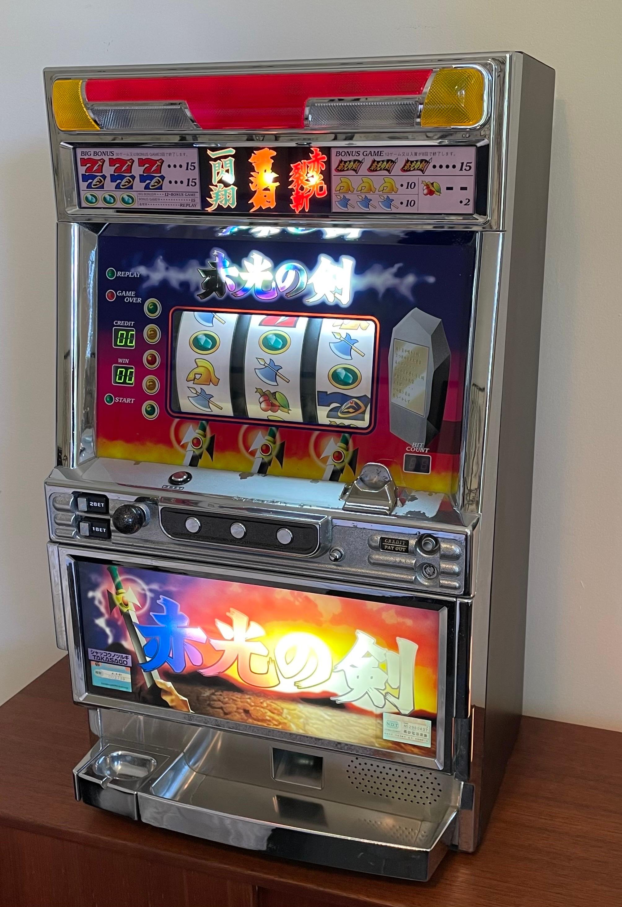 Very cool Japanese token slot machine, all original and in great working order, including keys. 300 to 400 gaming tokens included.