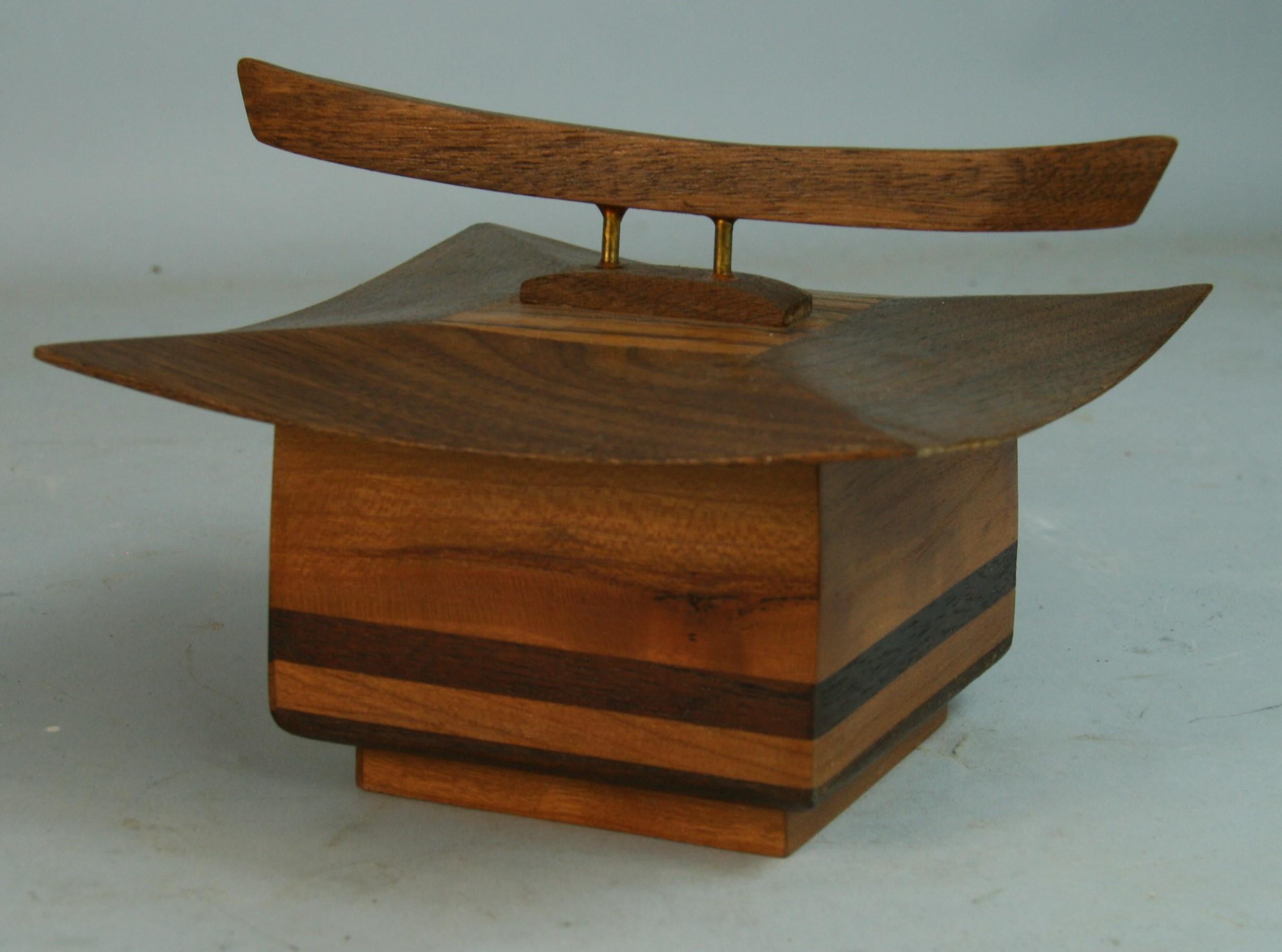 8-289  Japanese pagoda shaped trinket box made from walnut and oak with brass supporting the handle.