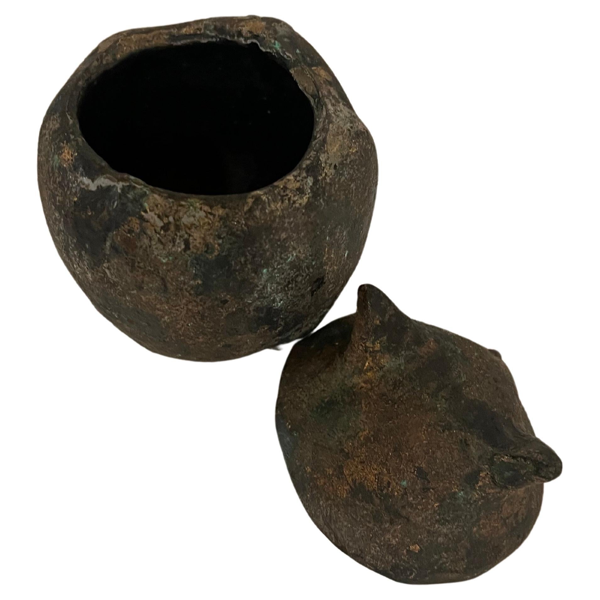 Mid-century patinated iron owl sculpture with a nice applied patina. Removable top for use as a lantern with a small candle or perhaps for burning incense, Japan, 1950s.