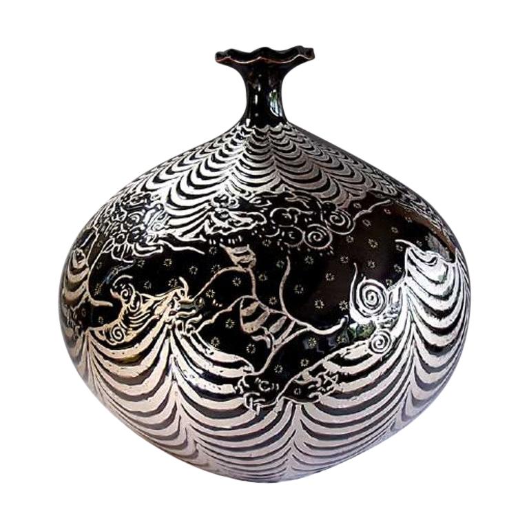 Unique contemporary Japanese decorative porcelain vase hand painted in platinum and black over a beautifully shaped body with a scalloped rim , an exclusive signature piece by a highly acclaimed award-winning Japanese master porcelain artist.  In