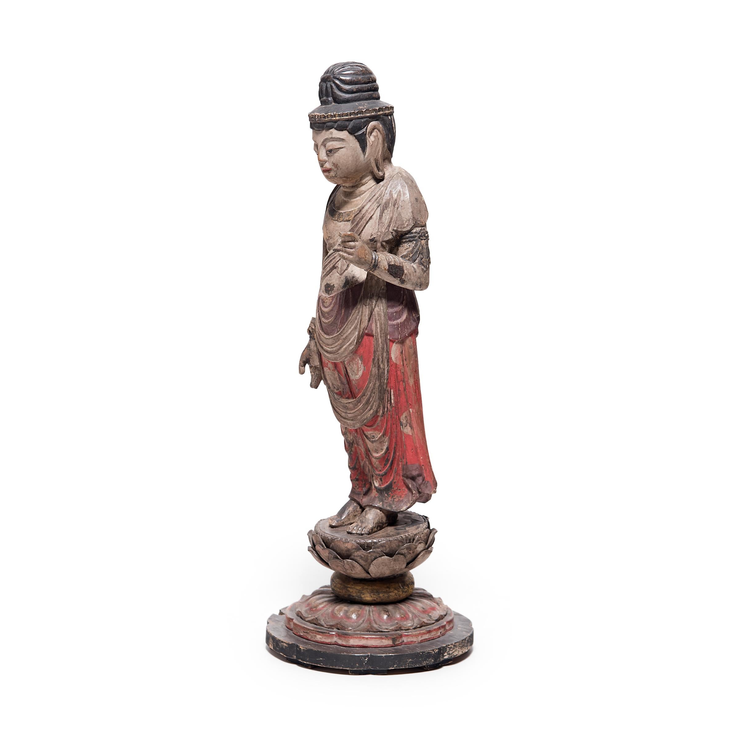 This late 19th century standing figure depicts the sacred form of the bodhisattva Guanyin, known in Japanese Buddhism as Sho Kannon, or Guze Kannon. Described as the 