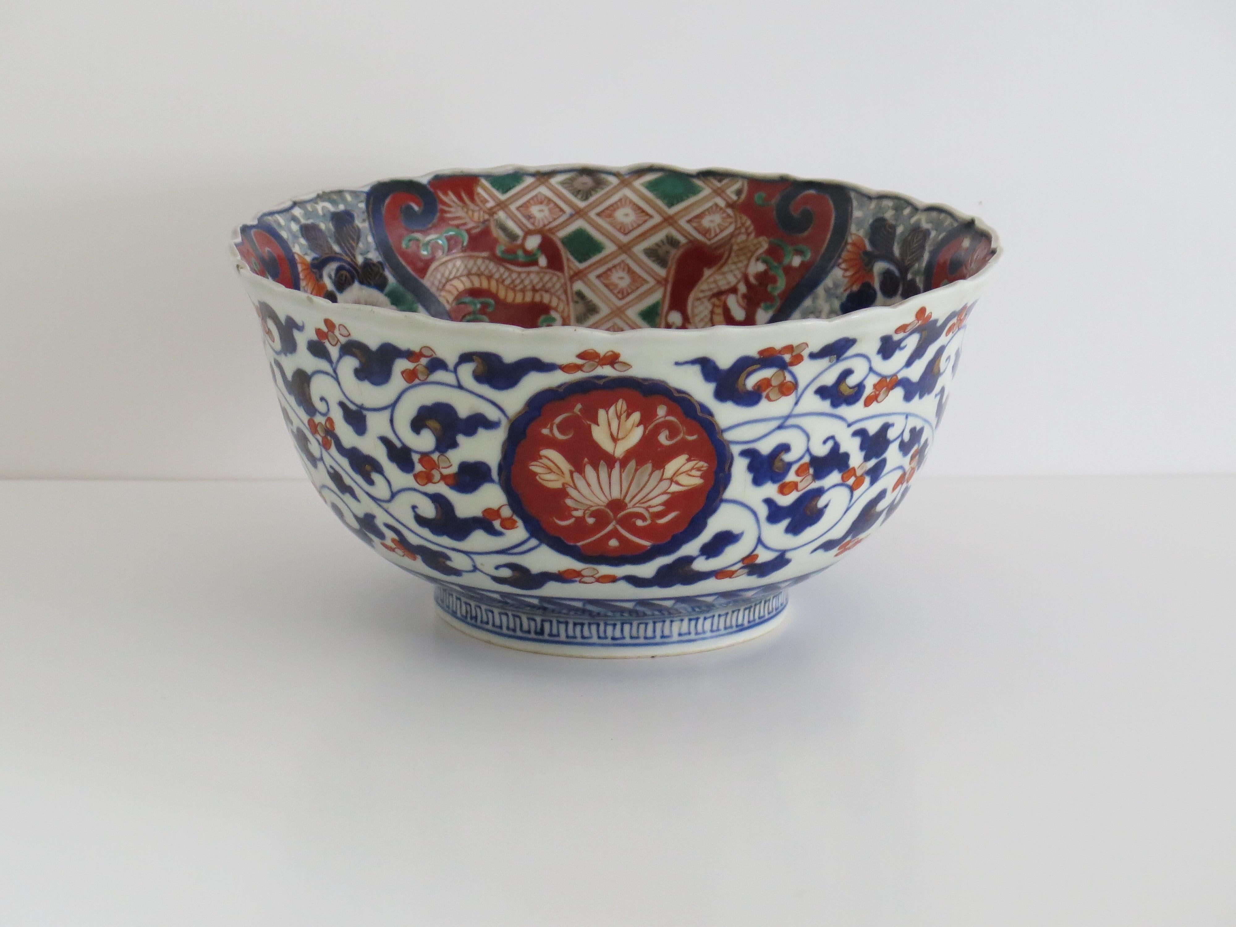 This is a good and very decorative porcelain footed deep bowl, hand-painted in polychrome enamels and dating to the second half of the 19th century, circa 1860, Meiji period.

The bowl is well hand potted with a circular deep shape, on a low