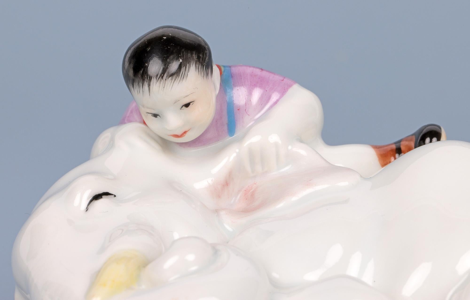 Glazed Japanese Porcelain Boy with Elephant Figure For Sale