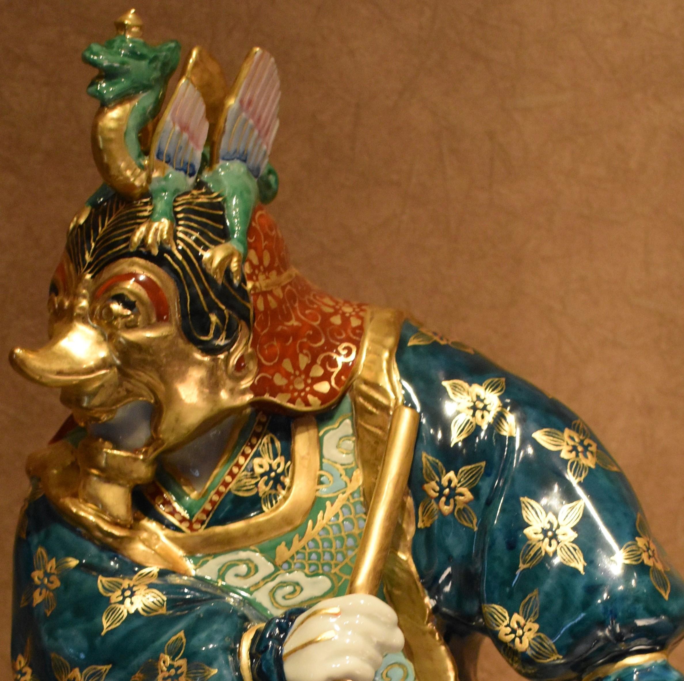 Unique porcelain figurine of Prince Lanling, hero-warrior of 6th century, China. This intricately detailed figurine is the creation of widely respected master porcelain artist of the Kutani region of Japan. Faithfully recreating the flowing folds of