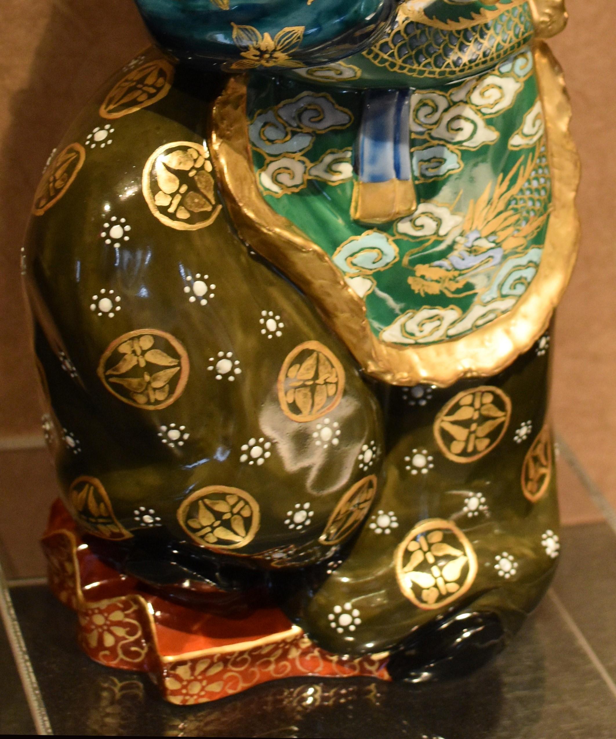 green japanese figurine