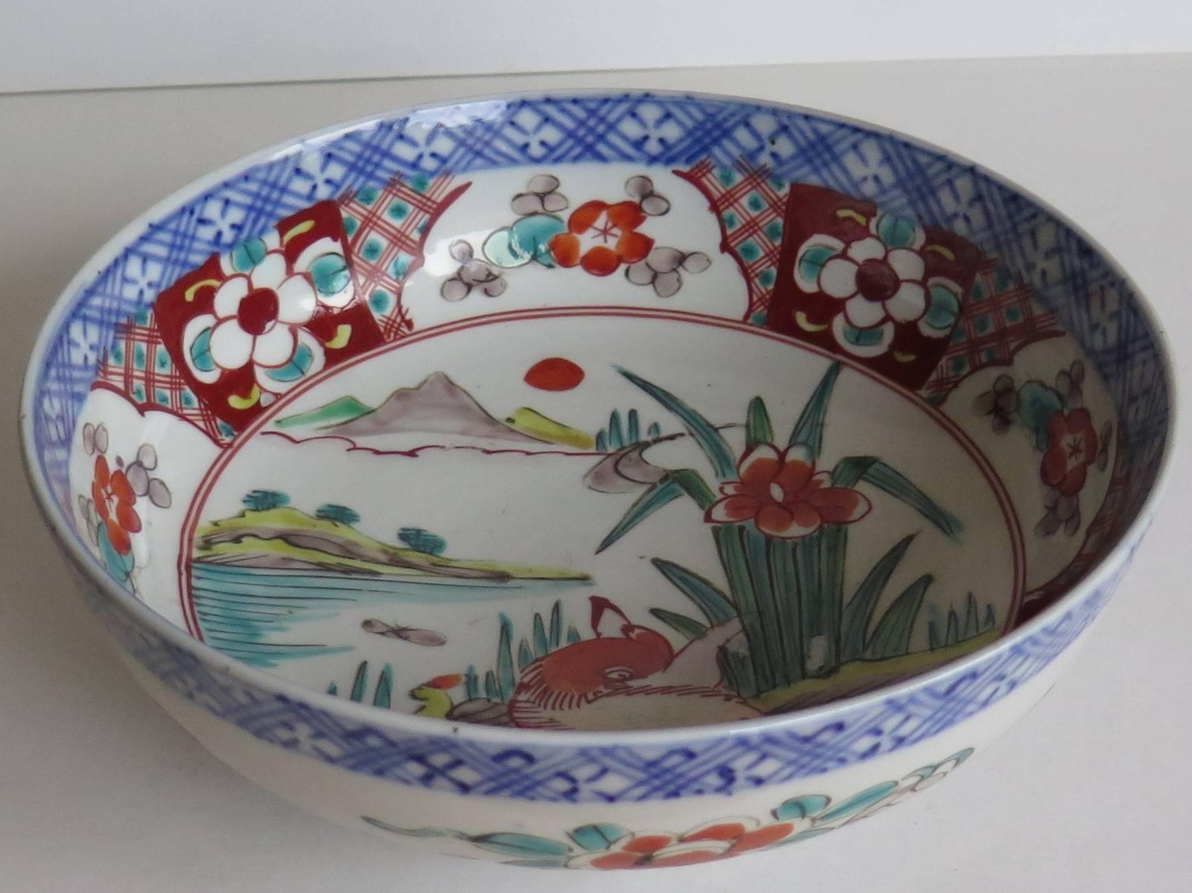 This is a good and very decorative porcelain footed bowl, hand-painted in polychrome enamels and dating to the later part of the 19th century, circa 1870, Meiji period.

The bowl is circular and well hand potted on a fairly deep foot.

This bowl