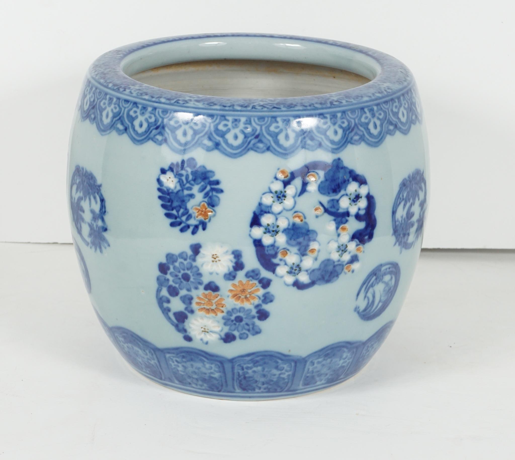 This porcelain Japanese hibachi or “Fire Bowl” was made in Japan circa 1900 to 1925. This is a traditional Japanese heating device and consists of a fireproof cylinder or box that can be made of many materials. This porcelain one is done in a
