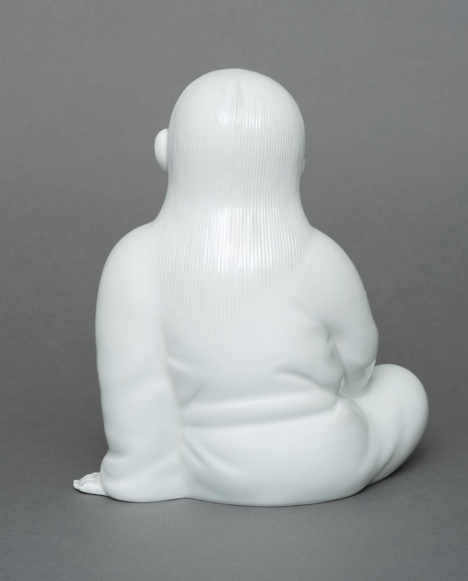 Japanese porcelain okimono 置物 of a sitting child, by Sakaida Kakiemon XII 1
