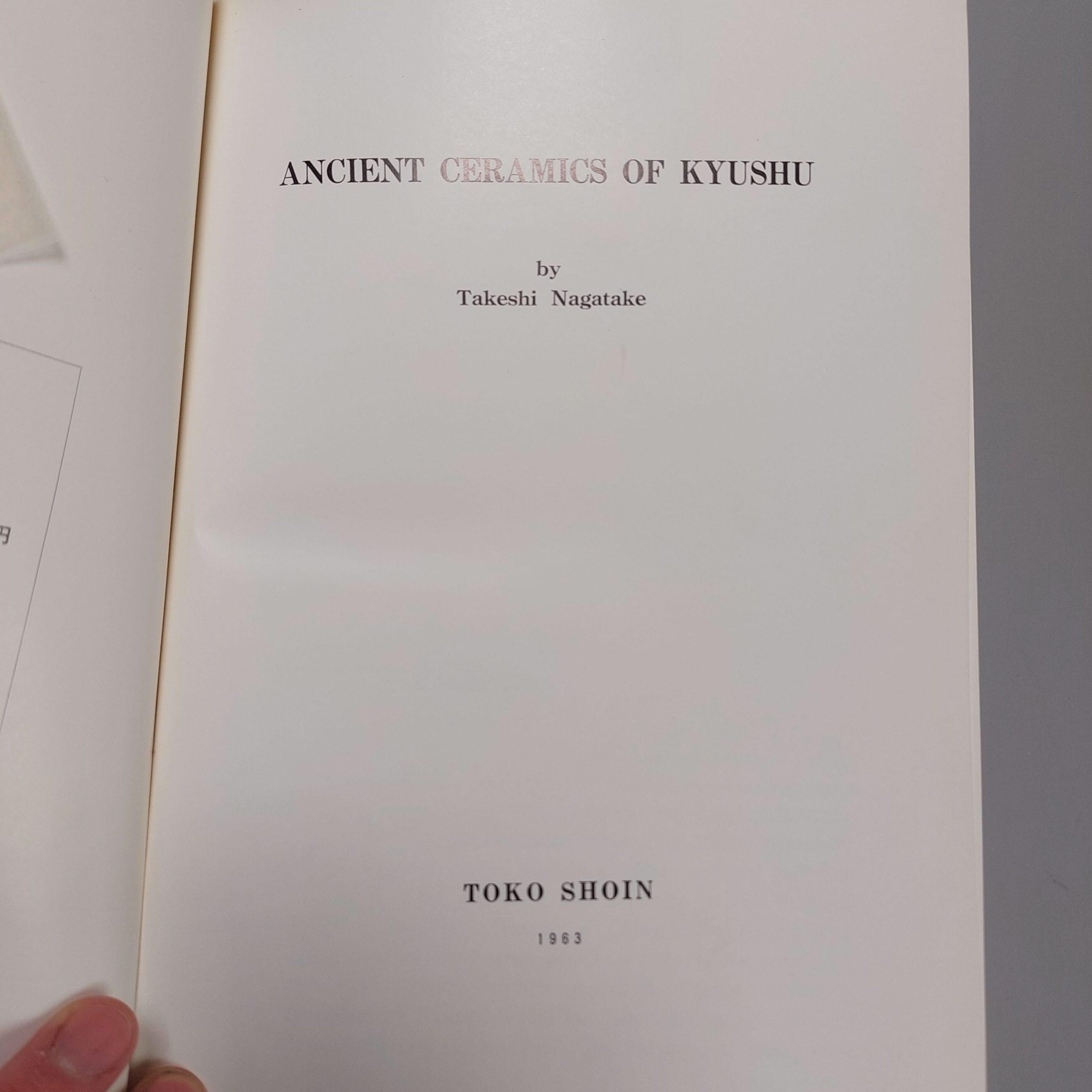 Ancient Ceramics of Kyushu
Nagatake, Takeshi
Tokyo, Japan: Toko Shoin, 1963.

Hardcover. dark cream linen boards w/ blind-stamped emblem & orange script. approx 400+ pgs w/ bw illustrations, section of color plates. VG (darkening & scuffs to cloth;