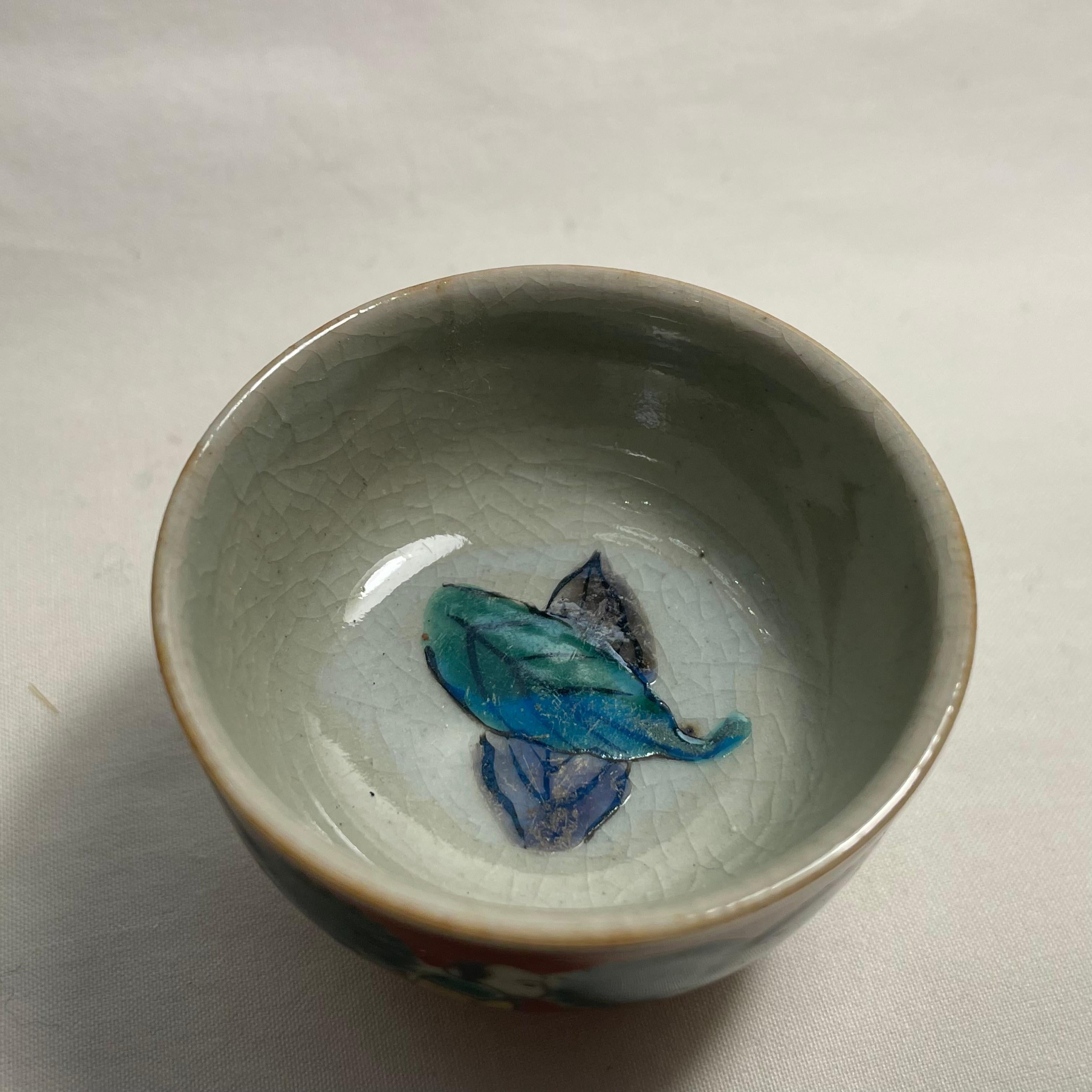 This is a small cup for drinking sake. It is called Ochoko in Japanese.
It was made in showa era around 1980s.  It is made with porcelain and all hand painted. 
This is Kutani ware. And it is they style called Mokubei AOKI.

Dimensions:
5.1 x 5.1 x