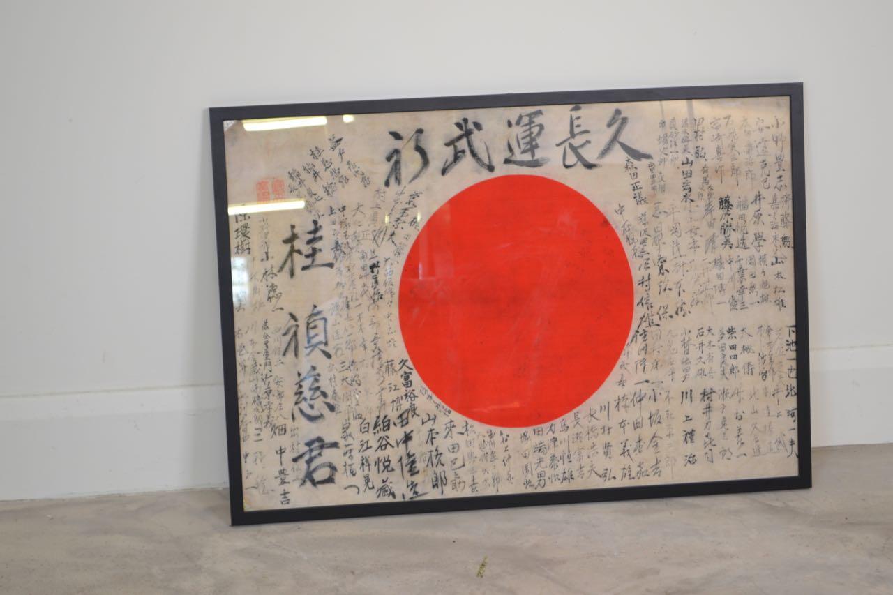 Japanese prayer flag with original calligraphy originating from 
the second world war. The calligraphy shows messages from family and friends for the soldier to return home safely.