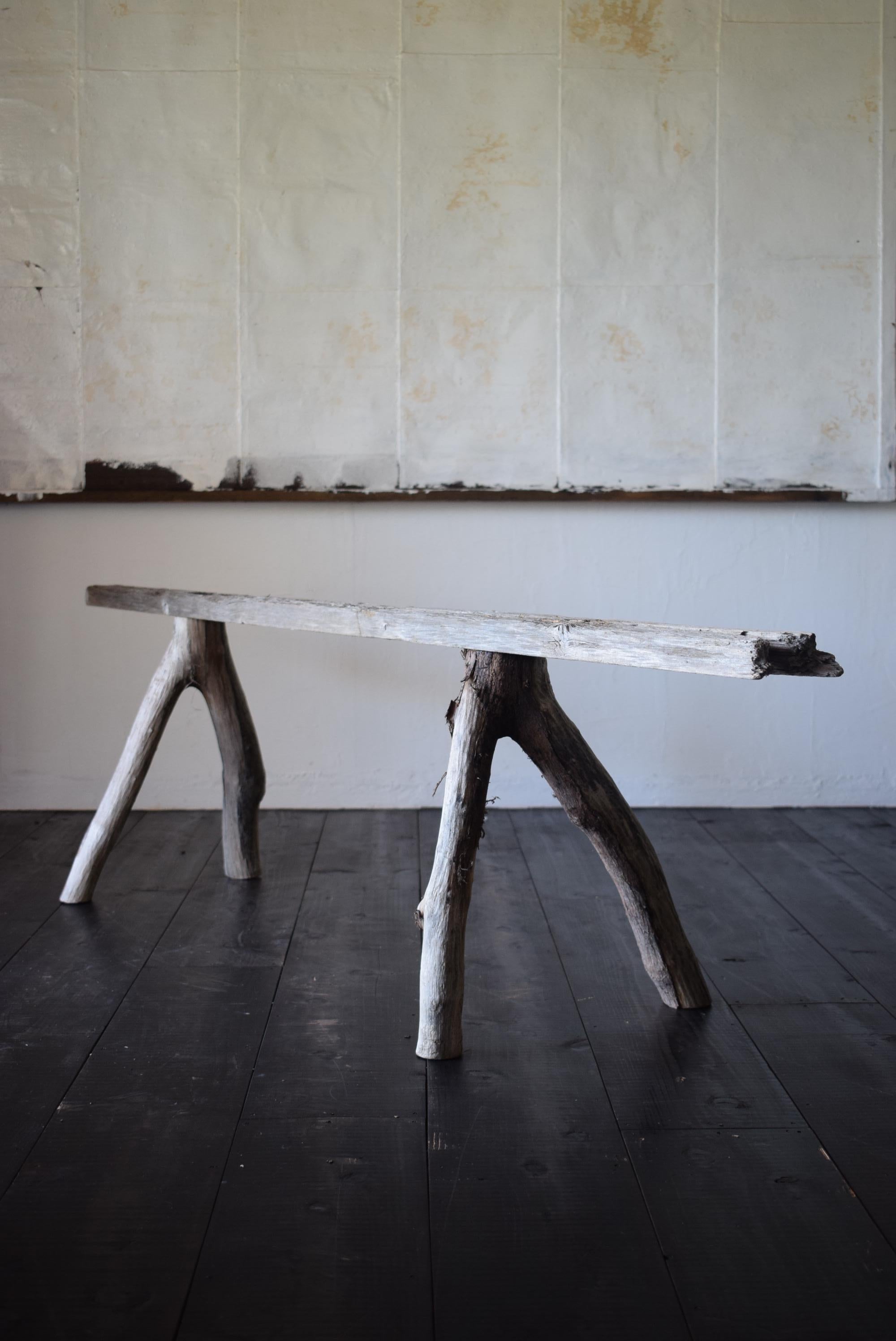It is a solid wooden bench that makes you feel Japanese wabi-sabi. 

It's made of driftwood, but you can also sit down. It is also beautiful as an object.