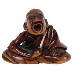 Estornudo profesional japonés Netsuke de madera de boj
