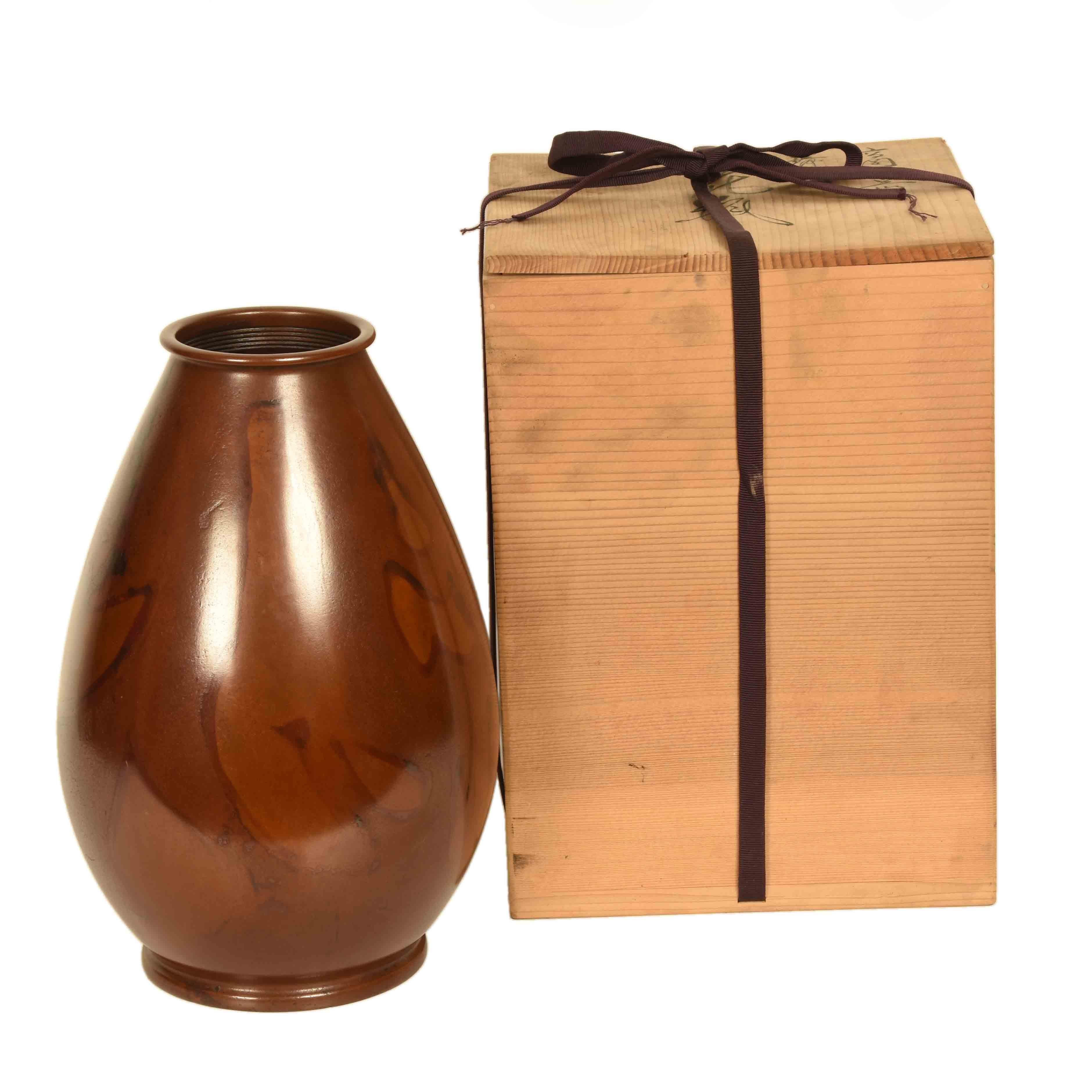 A vintage, Japanese red bronze vase from Yamagata. Yamagata is both a city and prefecture on the main island of Honshu. While bronze work originated in China, Japanese artisans have developed an array of techniques in the production of decorative