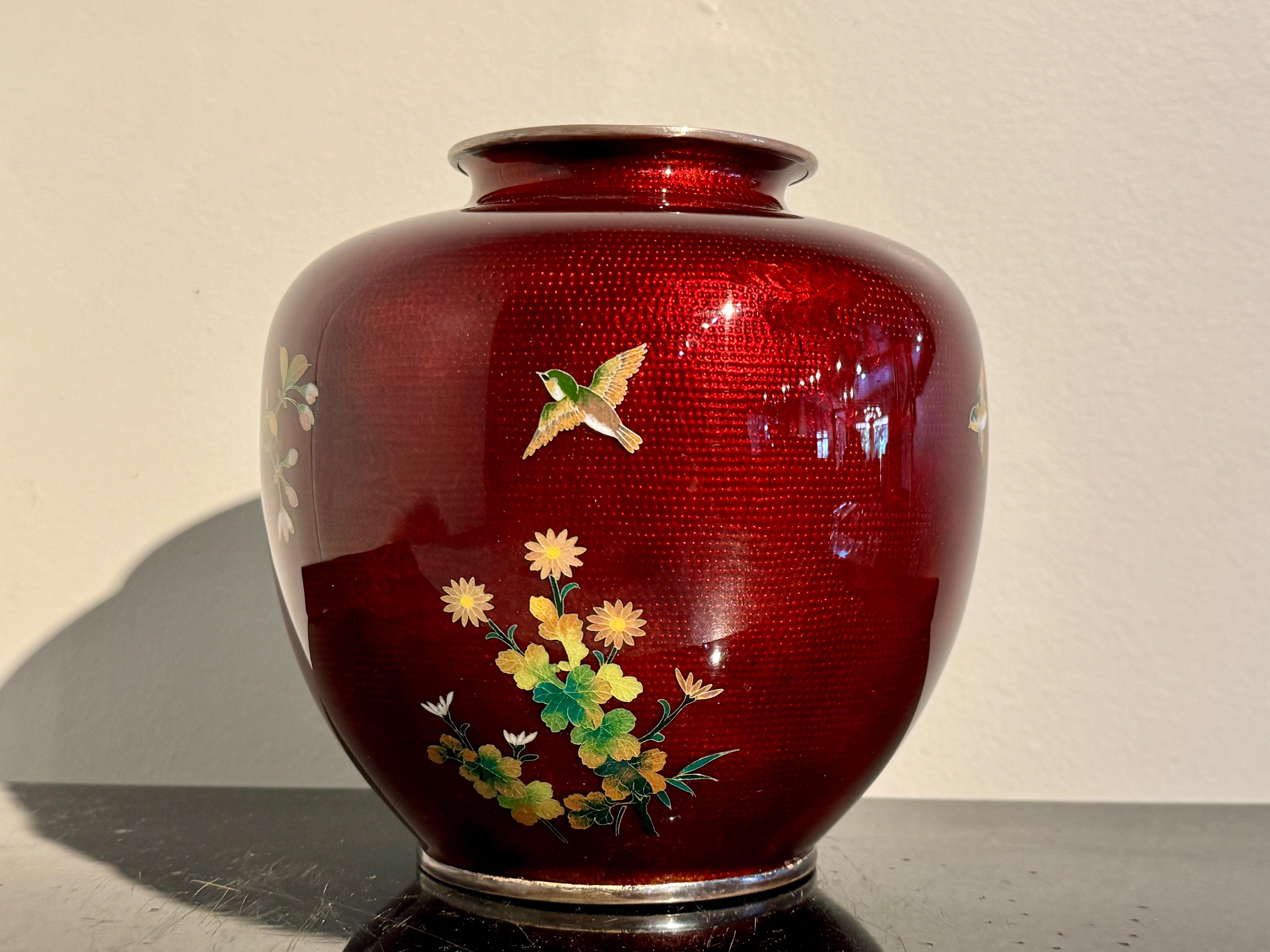 A very fine Japanese red ginbari and silver wire cloisonne vase, Meiji Period, circa 1900, Japan.

The striking cloisonne vase of overall deep red coloration and decorated in vibrant enamel of green, yellow, white, and pink. Large sprays of bamboo