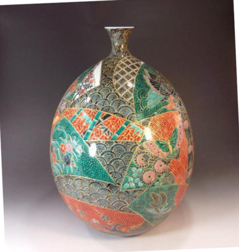 Exquisite contemporary Japanese decorative porcelain vase, intricately hand-painted in red, blue and green with generous gold details, a signed masterpiece from his signature series by highly respected award-winning Japanese master porcelain artist