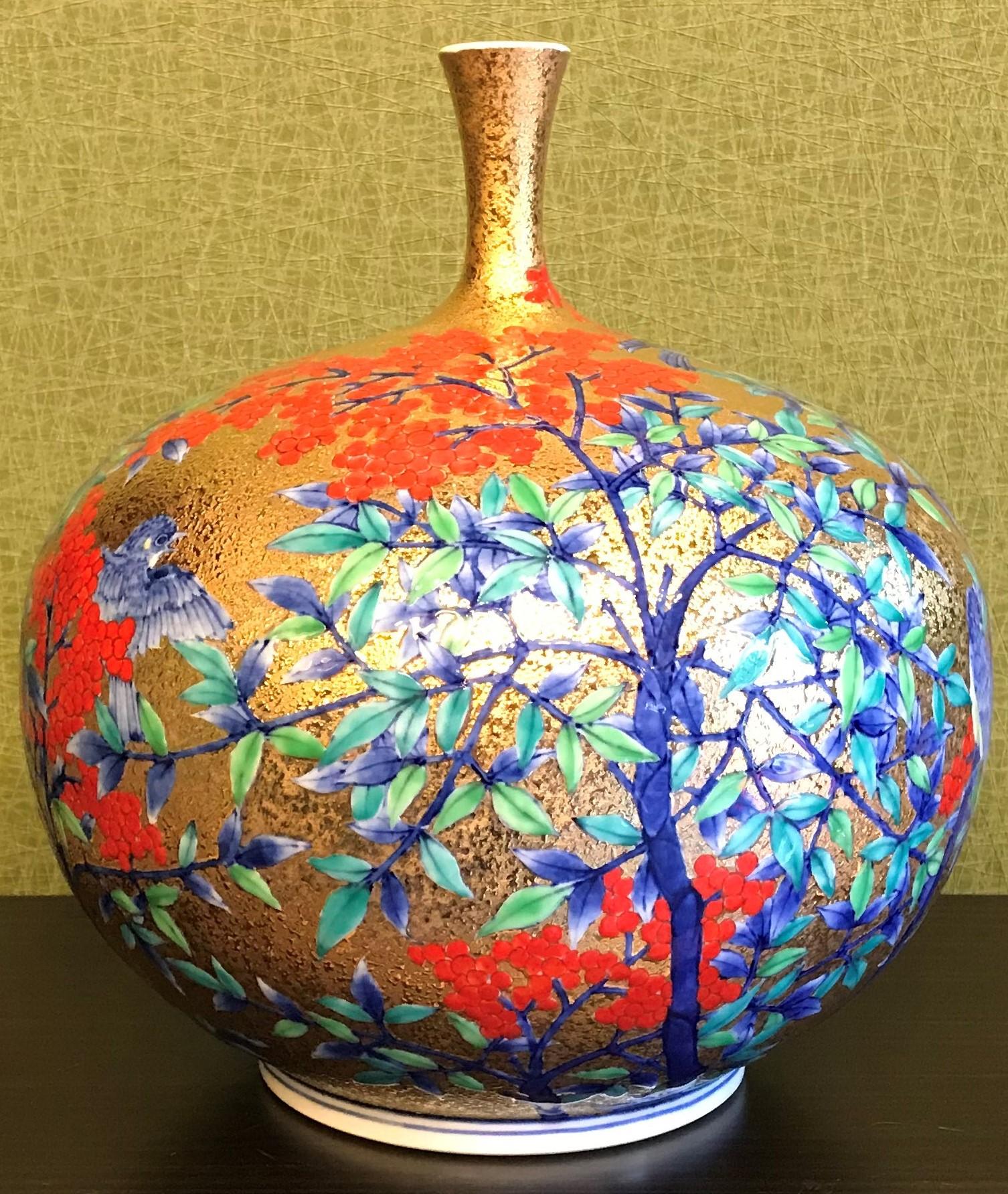 Exquisite contemporary gilded porcelain vase, intricately hand painted on an attractive gilded ovoid shaped body.
This piece is the work of highly respected award-winning master porcelain artist from the Imari-Arita region of Japan who is admired