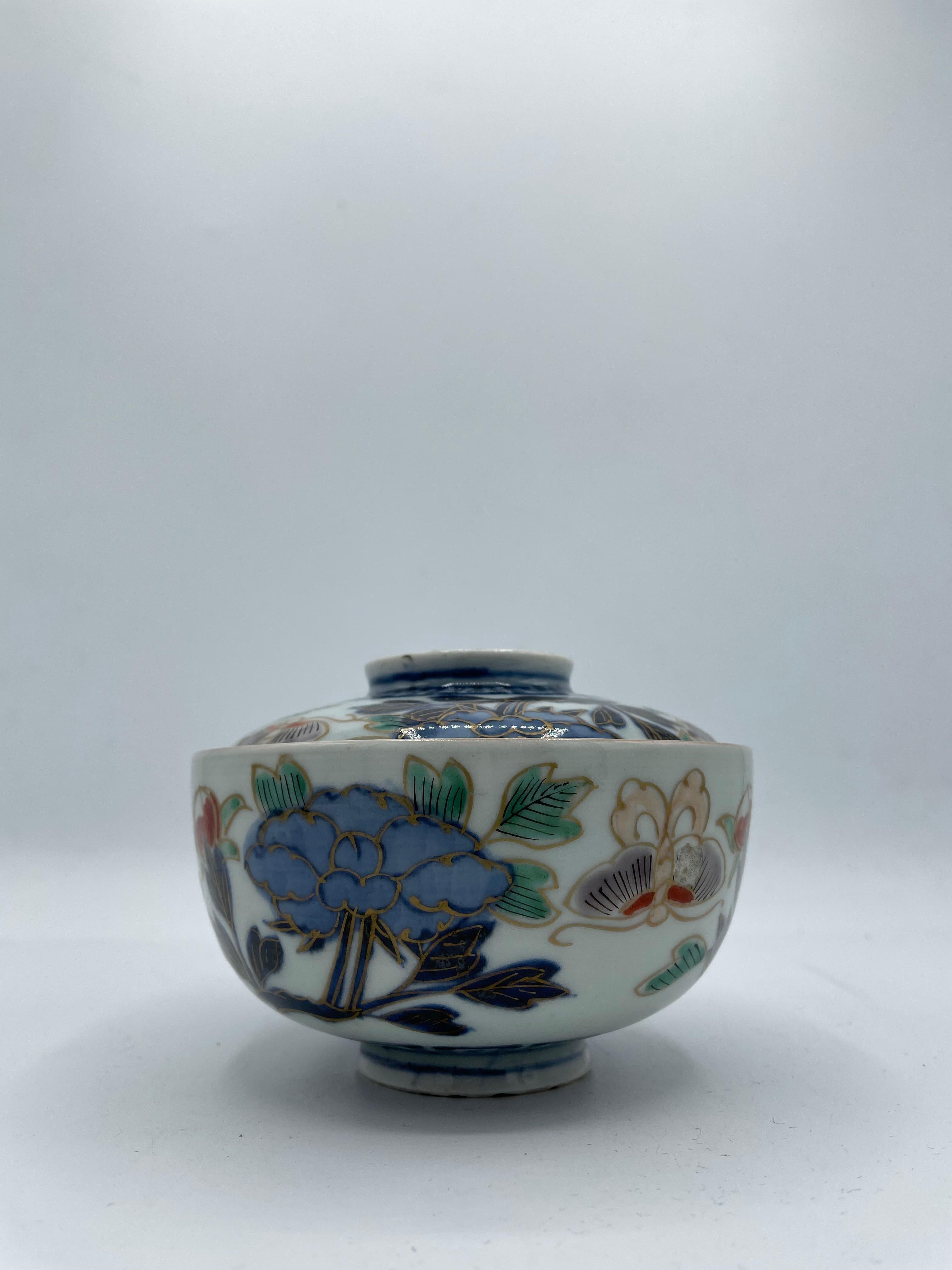 This is a Japanese rice bowl made in Saga prefecture, port of imari. 
It is made with Imari style ( Imari ware) and made around 1920s in Taisho era.
Taisho era was from 1912 to 1926. 
Imari ware is decorated in underglaze blue, with red, gold,