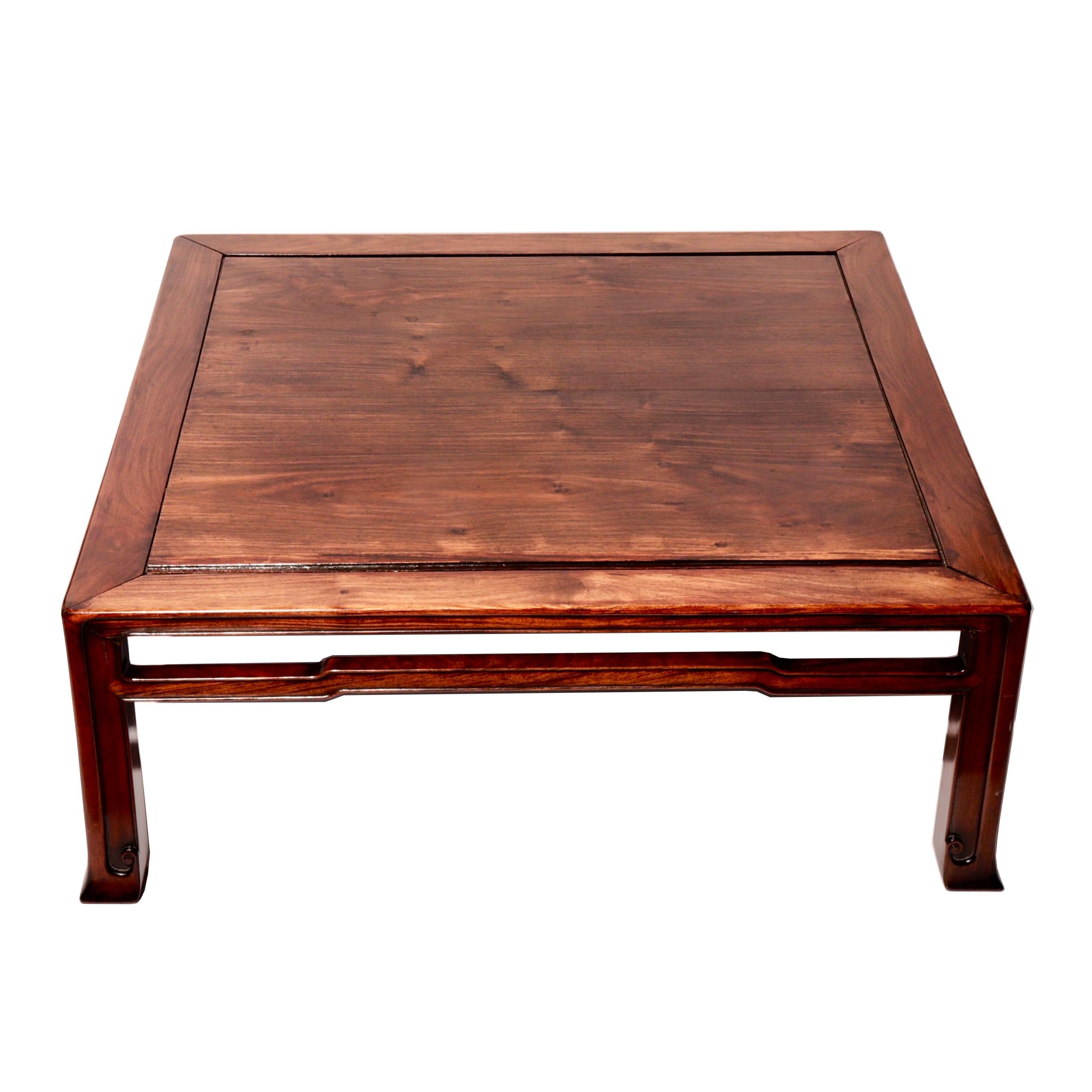 Japanese rosewood square tea table in Chinese style having tapered legs with bracket hoof feet, elbowed cross-struts and a center floating panel.
Condition: Minor shrinkage, surface scratches, and signs of age otherwise fine condition.
Measure: 13