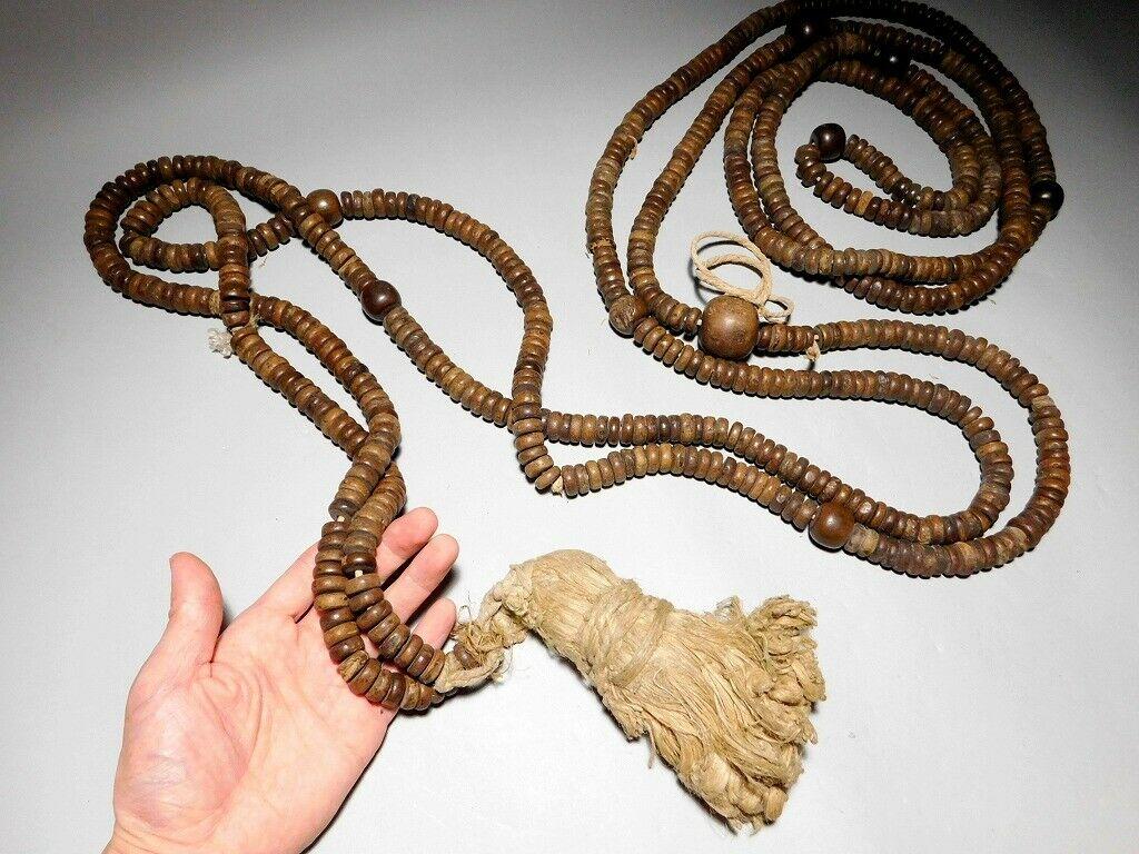 Rare find 18 feet long

A huge antique communal 18 foot prayer bead necklace consisting of over 800 handcrafted wooden hard wood beads with a large central largest diameter 
