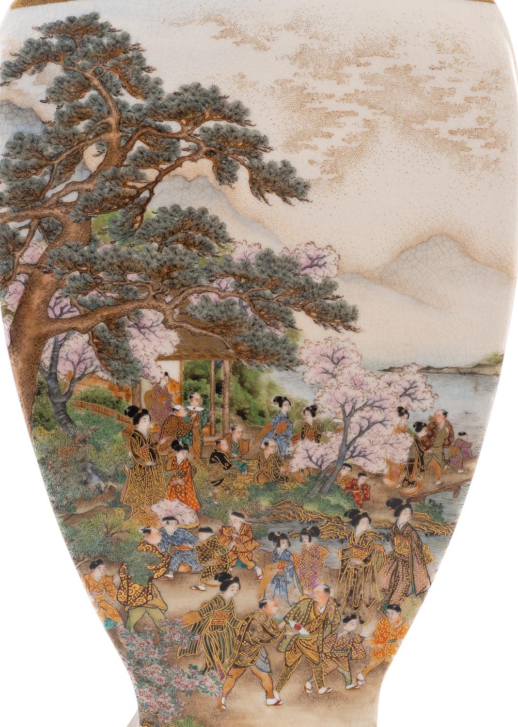 A fine quality large late 19th century Japanese Ryozan Satsuma vase, depicting men, women and children in leisurely activities set in the gardens on the mountain side with a lake in the distance. Geometric classical gilded motif decoration to the