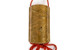 Japanese Sagemono Inro box with a maki-e decor of a Samuari in a lake landscape