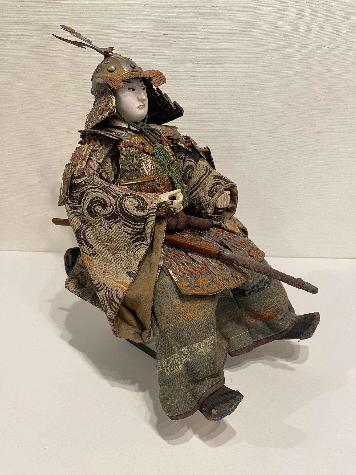 Japanese Samurai doll or figure, Meiji period, Circa 1830. Brown and green skirt colors.
 