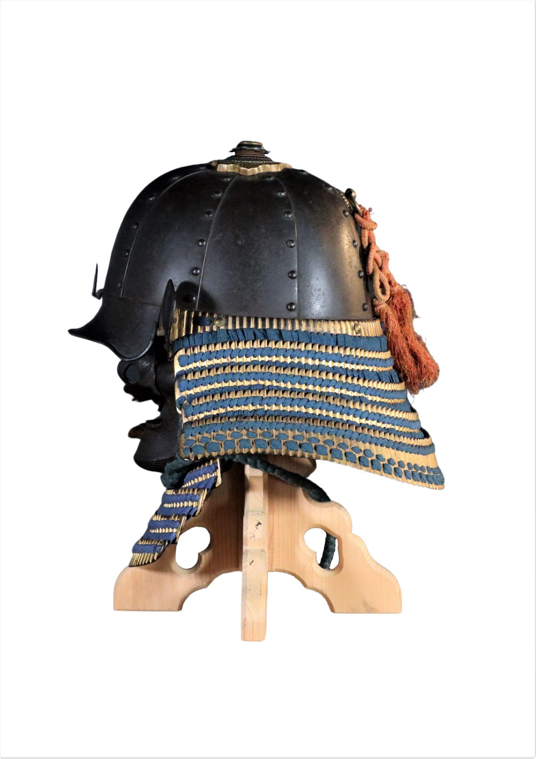 Signed Bamen School Tomonori; Jo I, early Edo period (ca. 1620) Tetsu Sabiji 8 Ken Hoshi Kabuto with Yasuri Menpo. (VERY HEAVY - Built for war!)

An Iron Hoshi Kabuto with Yasurime Menpo

Constructed of eight very heavy gauge russet-iron plates