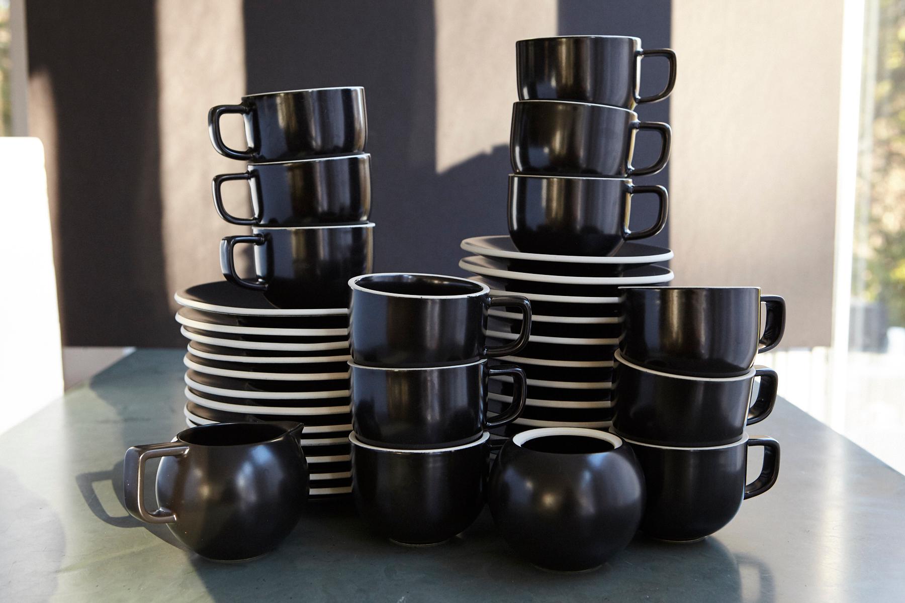 Impressive Sasaki Color stone coffee service for 12 people in matte black glazed stoneware, designed by Massimo Vignelli, Made in Japan, 1980s.
12 breakfast plates, 12 saucers, 12 cup, 1 creamer and 1 sugar bowl, a total of 38 pieces.
Please note